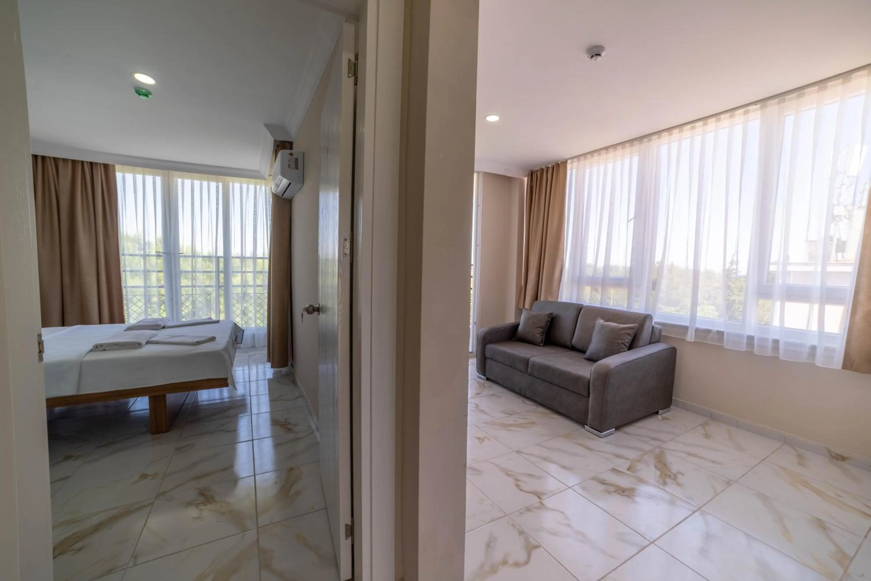 Living room, Bed in REGA OTEL