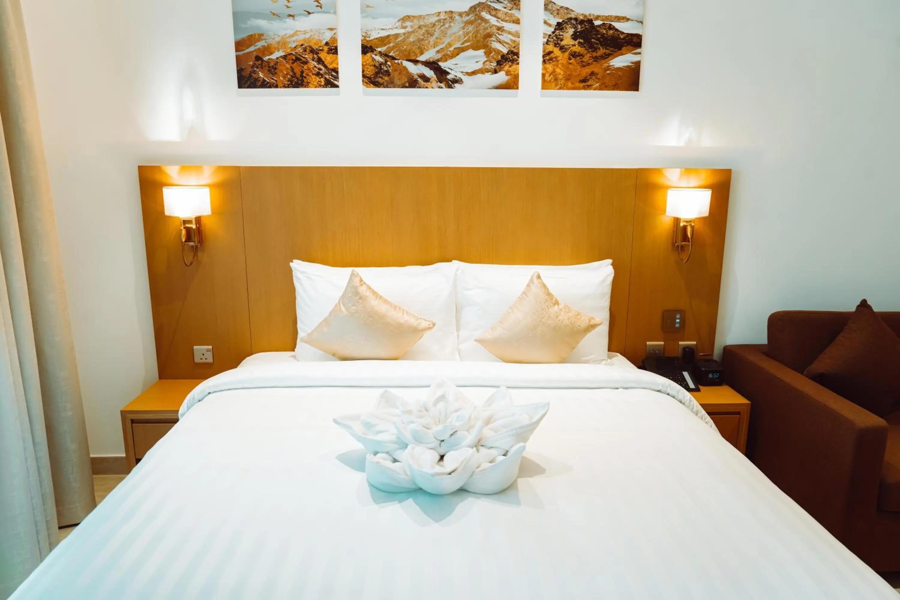 Bed in HE Hotel Apartments