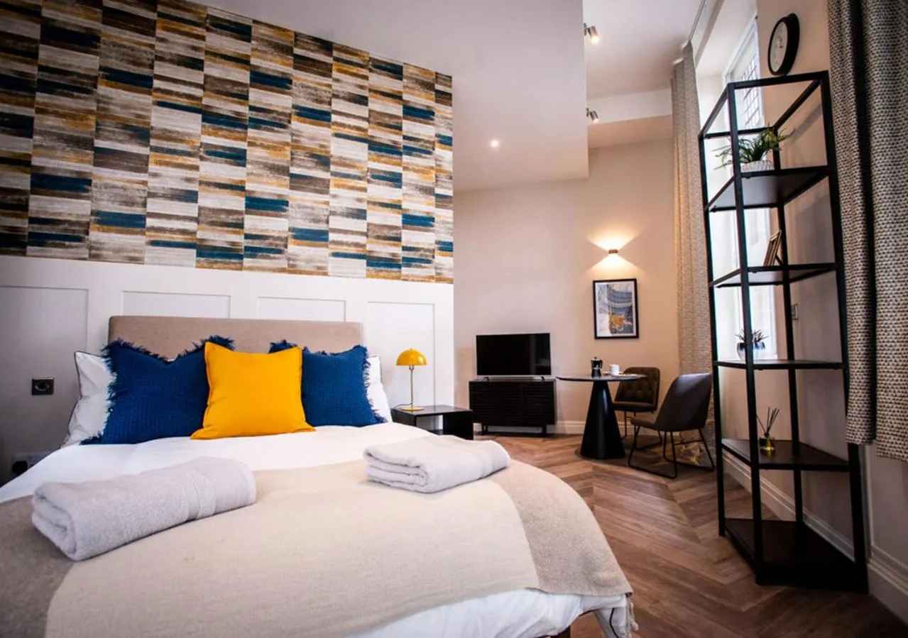 Bed in The Gresham Aparthotel