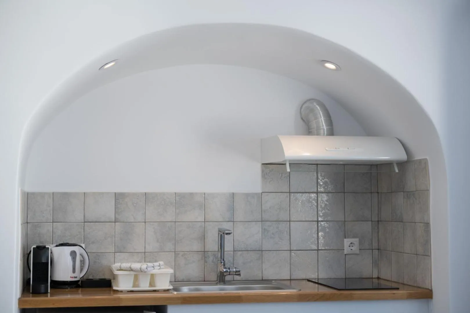 Kitchen or kitchenette in Sun Angelos Oia - Luxury Cave Suites