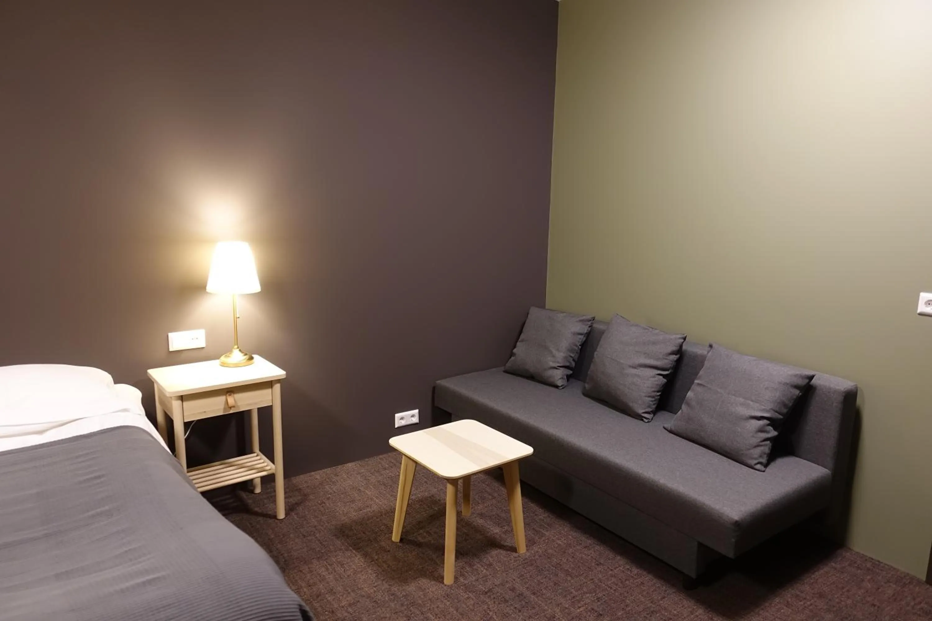 Living room, Bed in Basalt Hotel