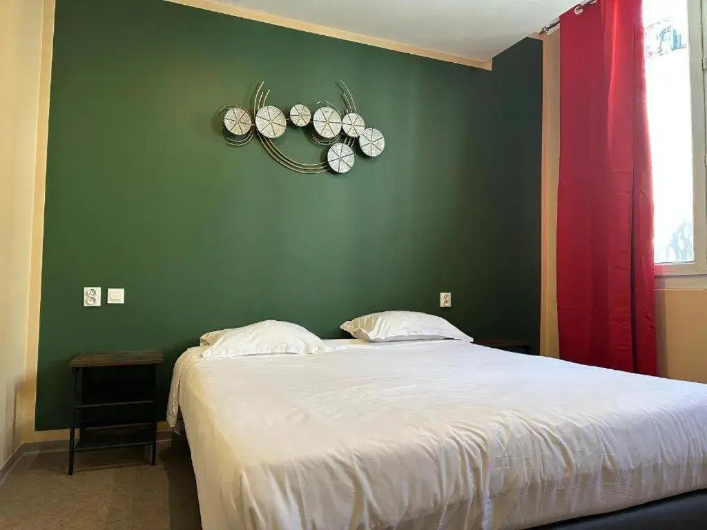 Bed in Hôtel Beauséjour Bed in Hôtel Beauséjour