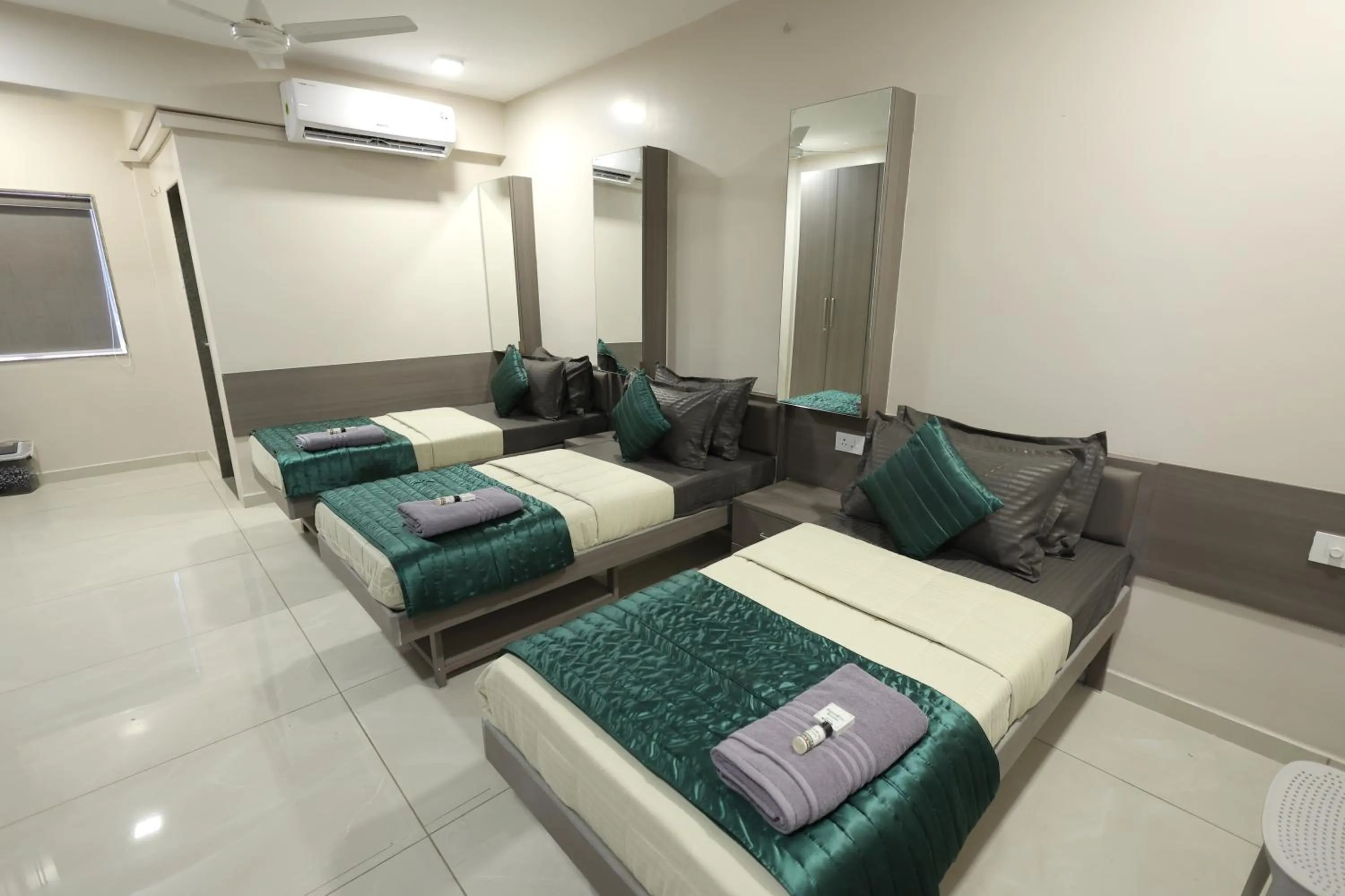 Bed in Greenotel Rooms Hazira, Surat