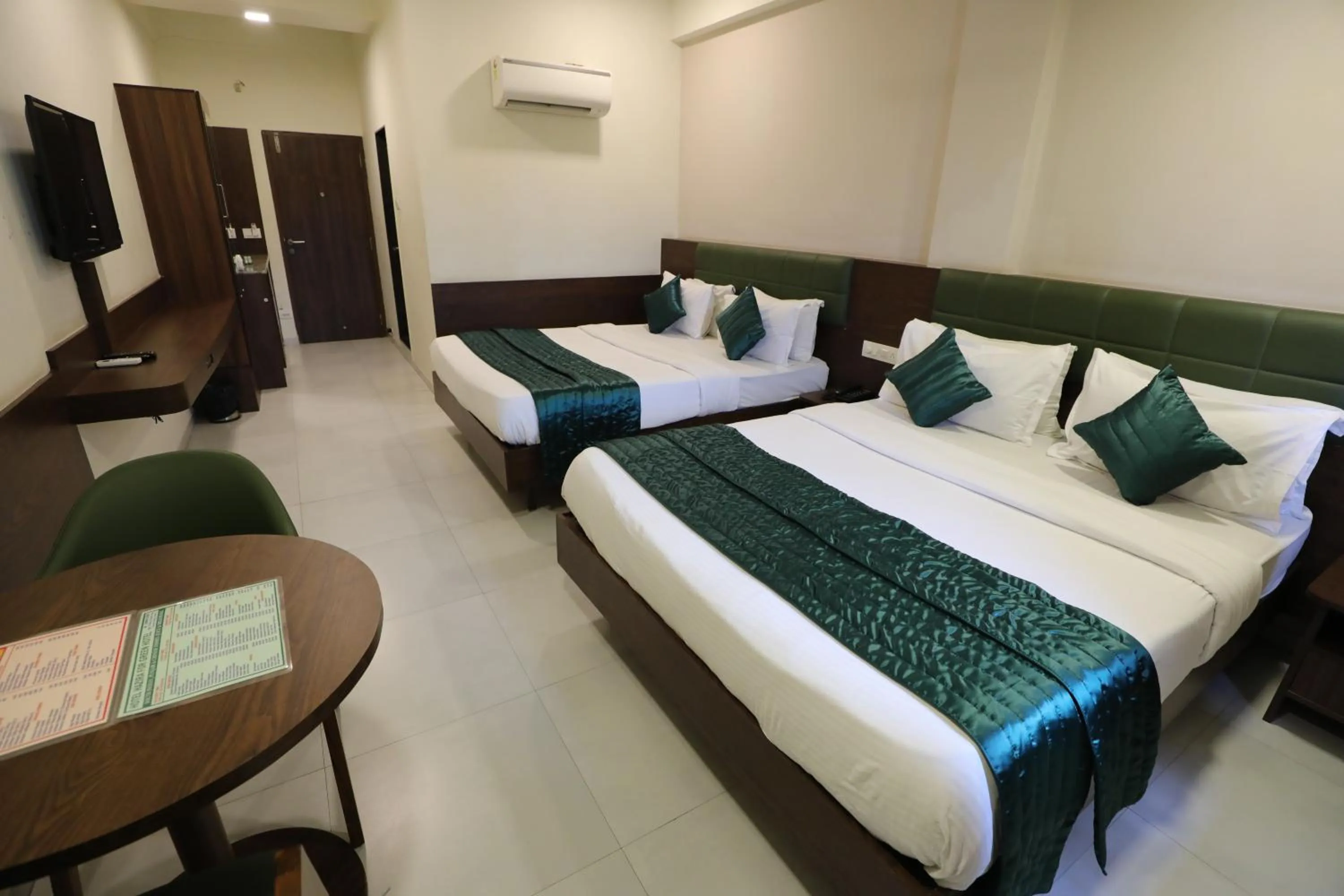 Bed in Greenotel Rooms Hazira, Surat
