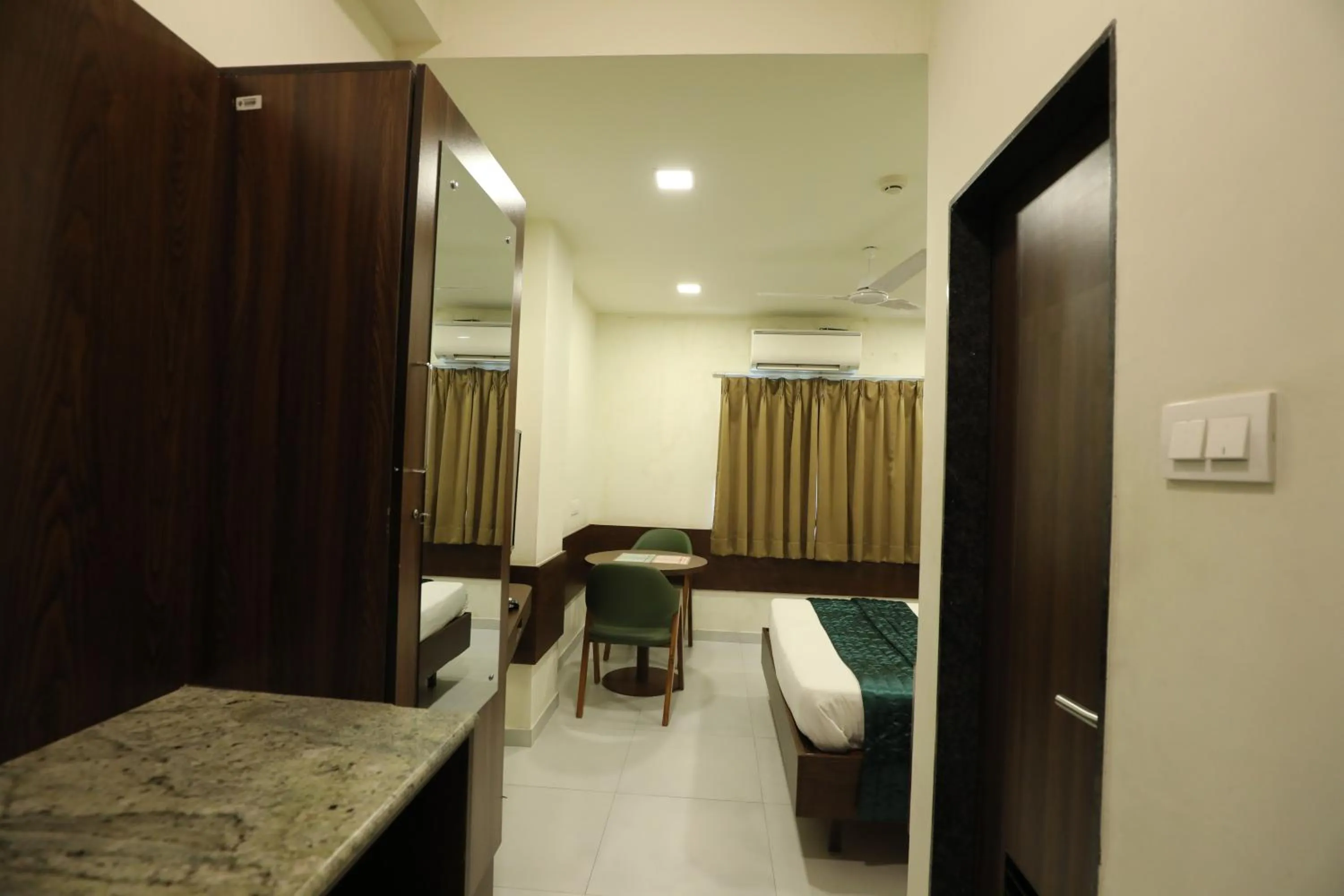 Bed in Greenotel Rooms Hazira, Surat
