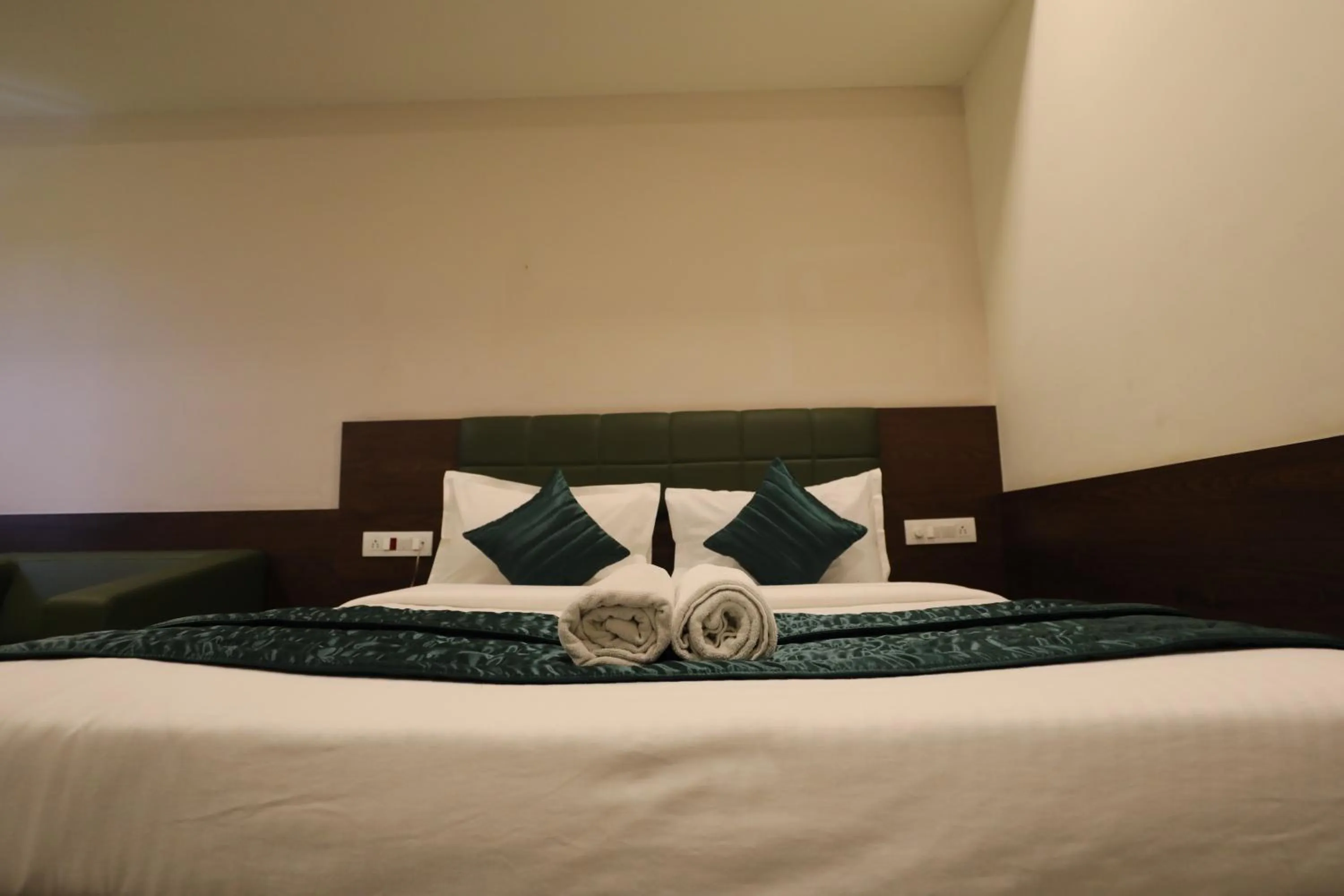 Bed in Greenotel Rooms Hazira, Surat