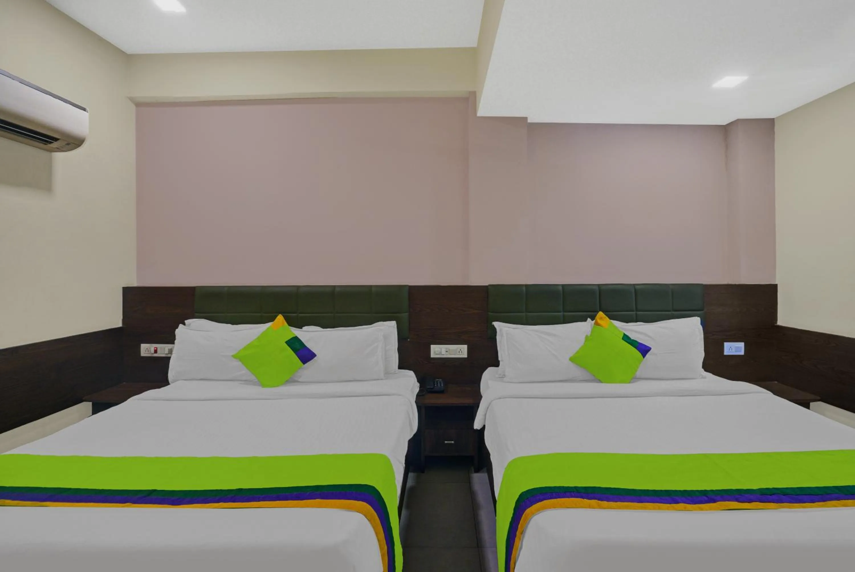 Bed in Greenotel Rooms Hazira, Surat