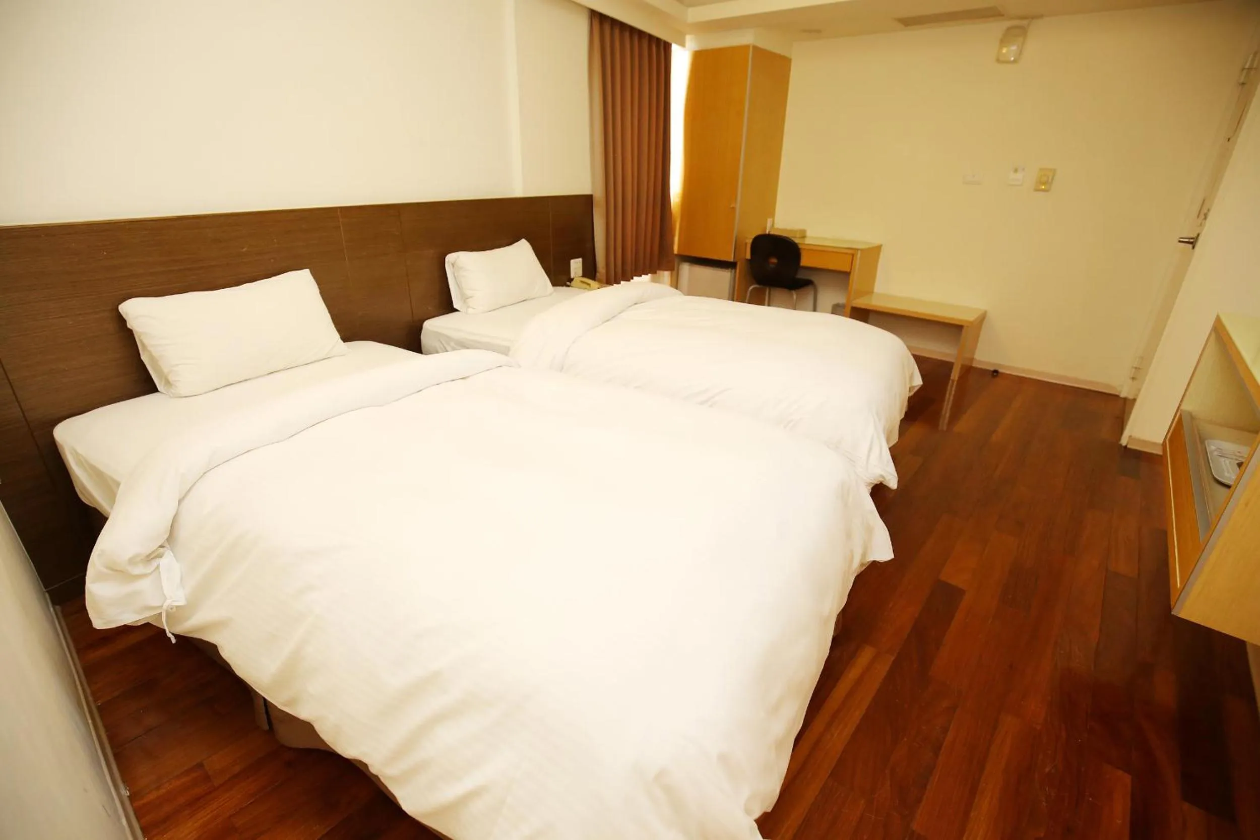 Bed in Tai Shinu Hotel