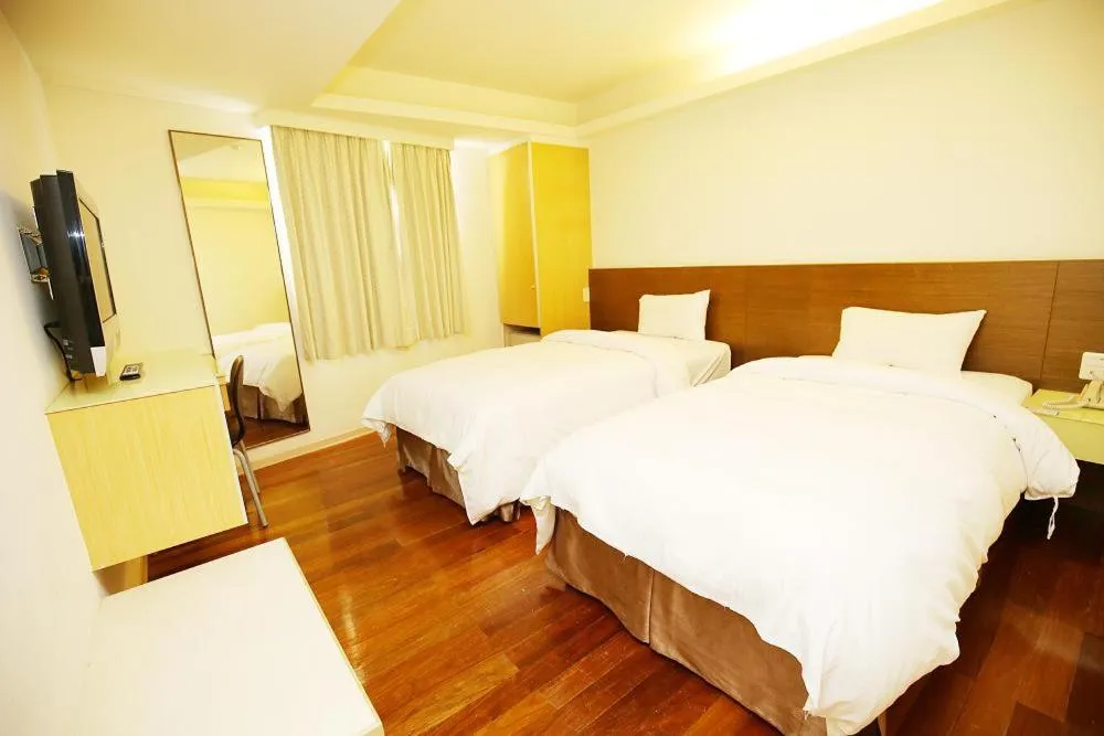 Bed in Tai Shinu Hotel