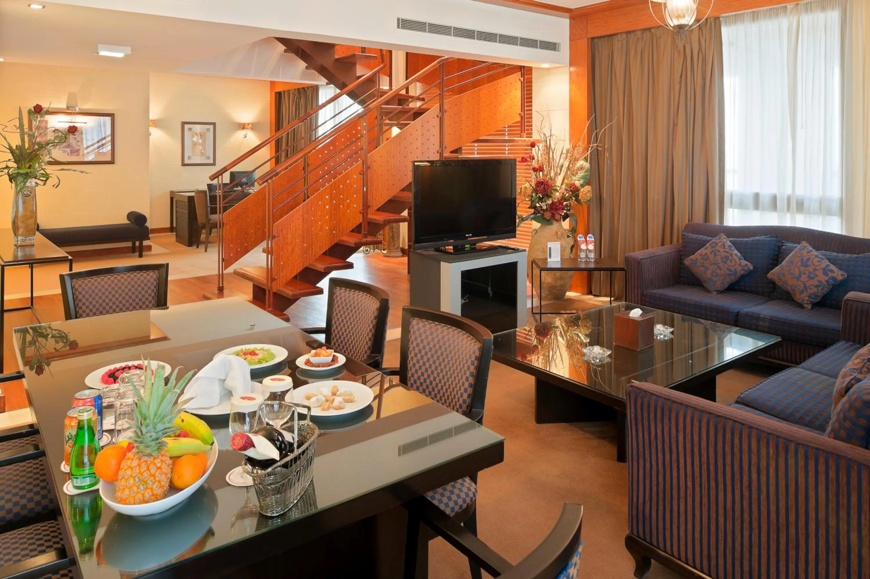 Communal lounge/ TV room in Crowne Plaza Hamra Beirut by IHG