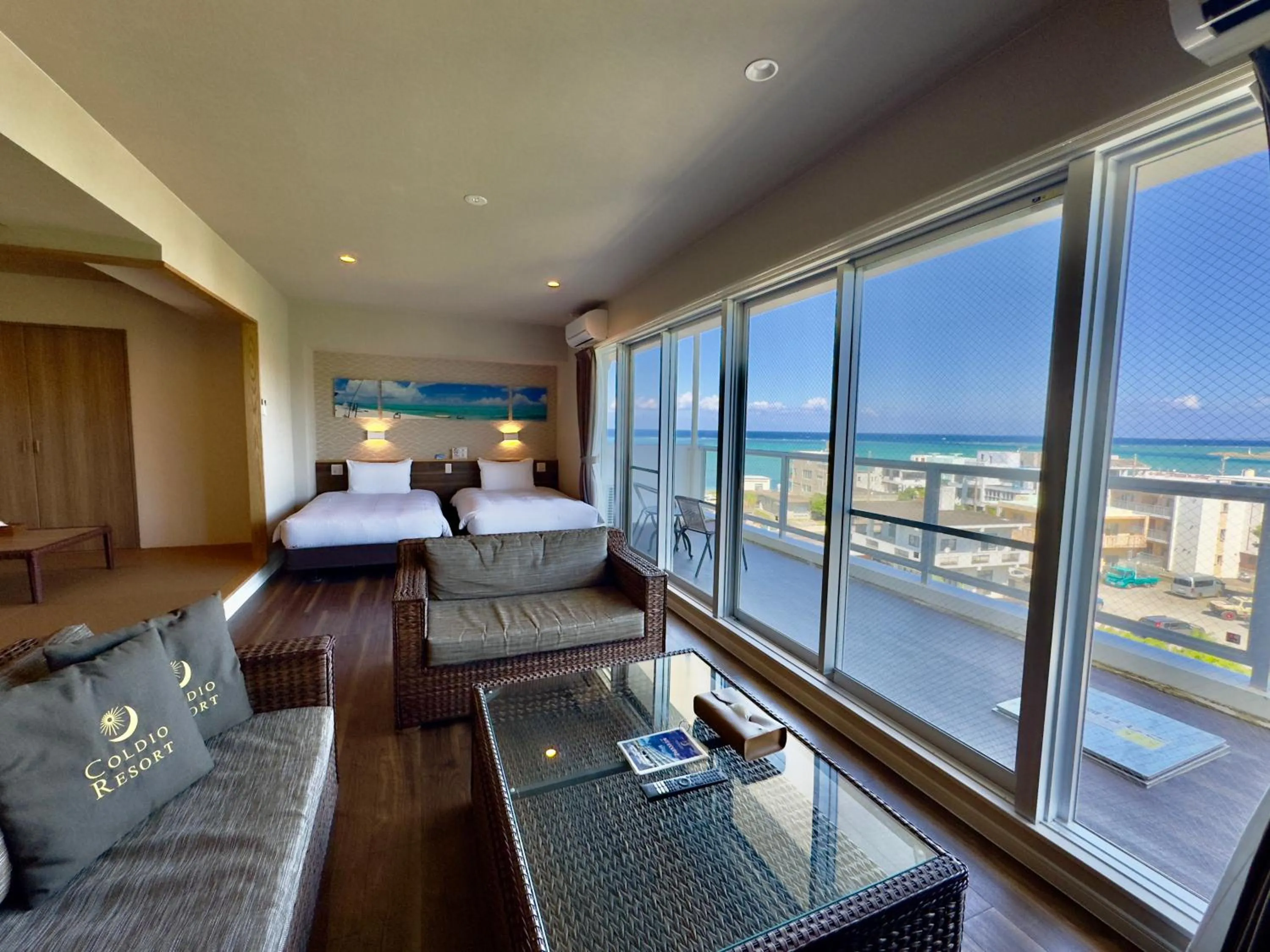 Bed in Coral Palace Onna by Sunset Avenue