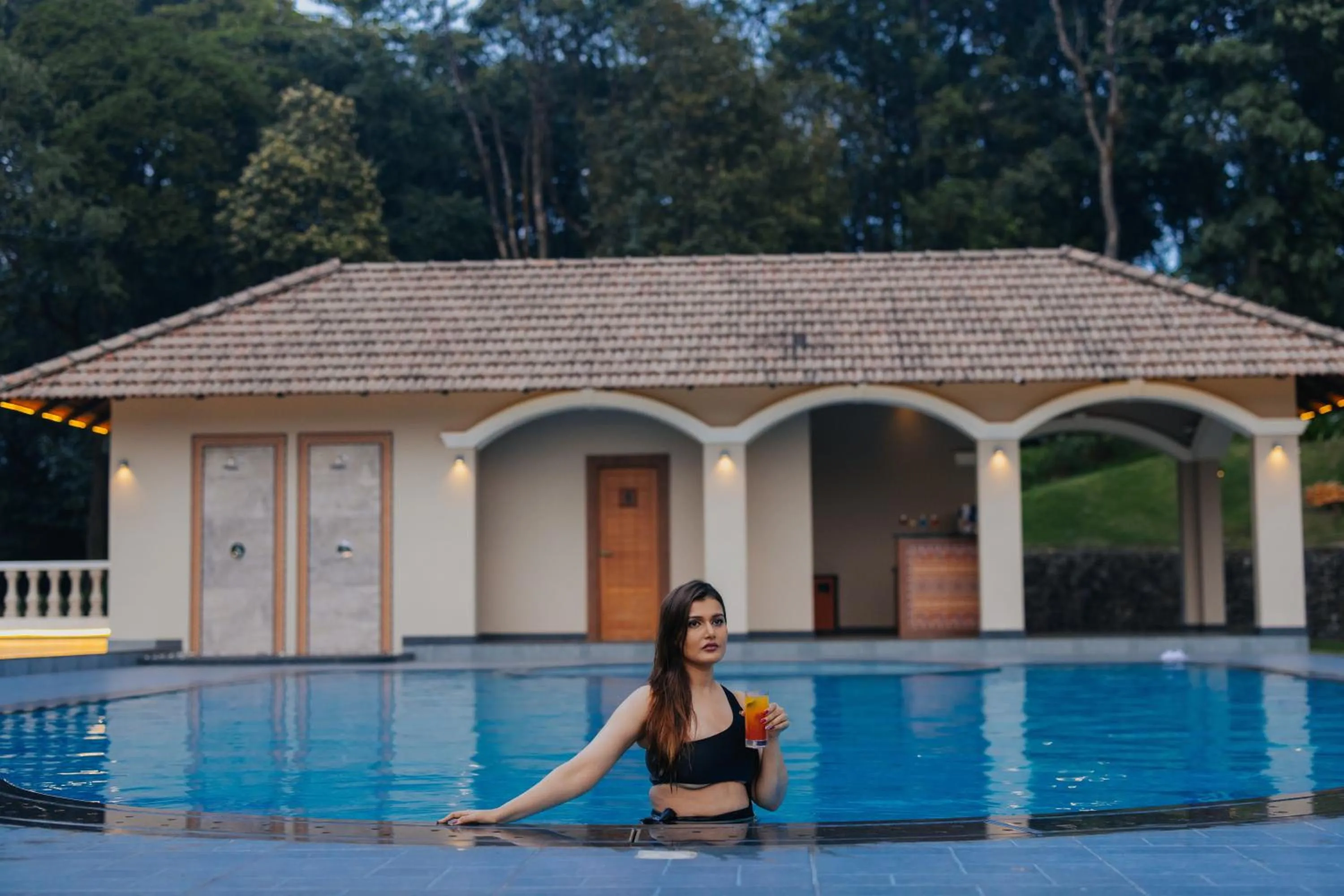 Swimming pool in Montrose Golf Resort and Spa - Coorg
