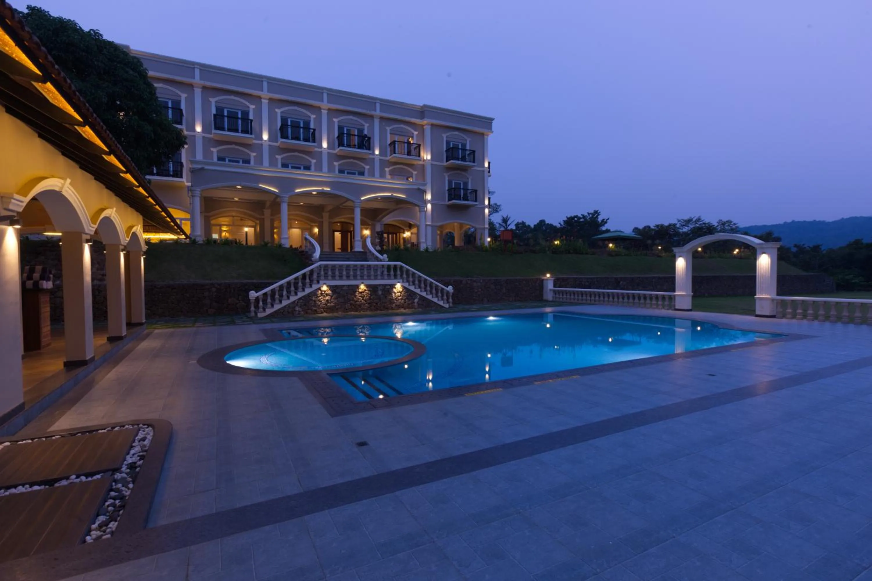 Swimming pool in Montrose Golf Resort and Spa - Coorg