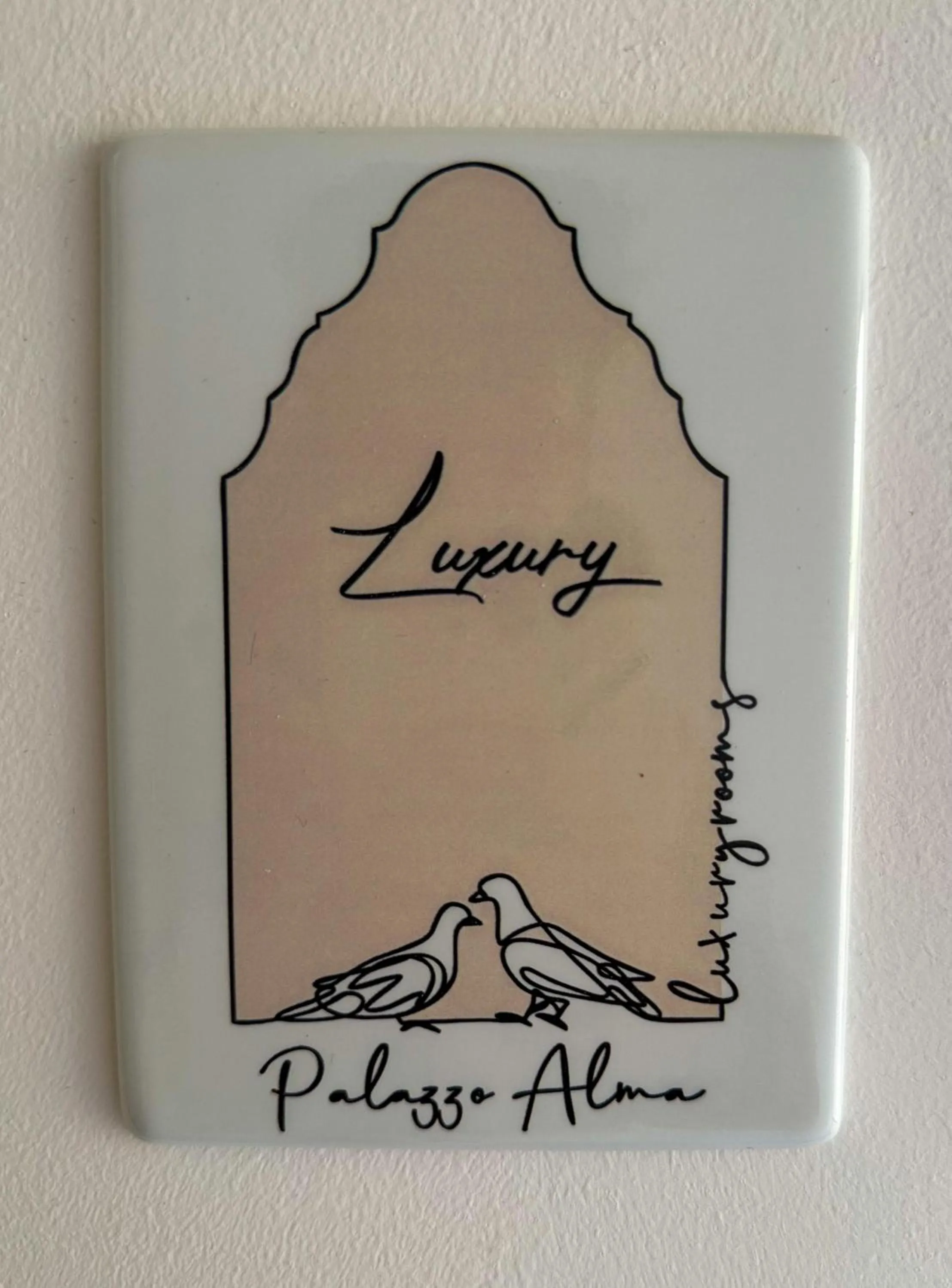 Property logo or sign in Palazzo Alma luxury rooms