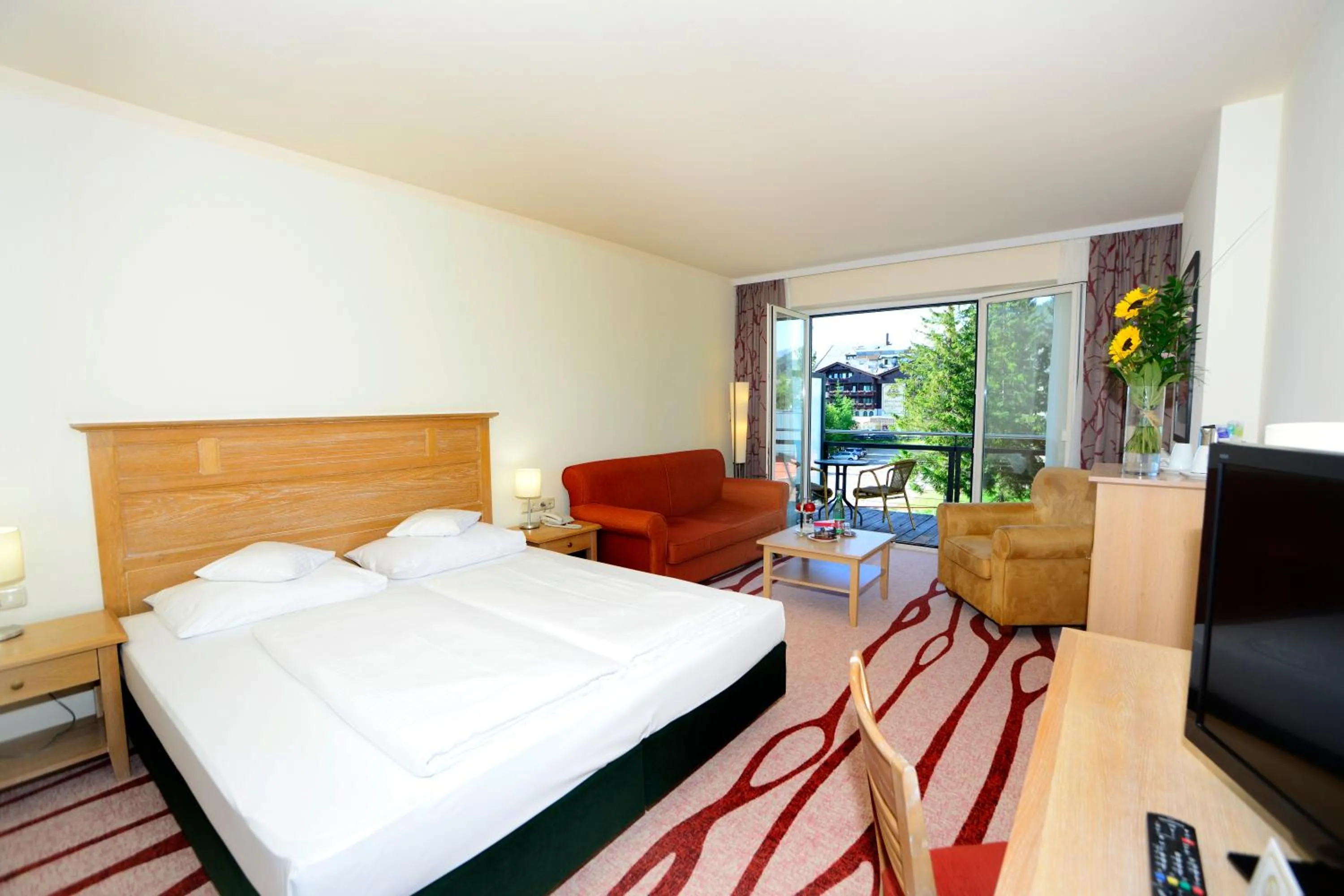 Photo of the whole room, Bed in Das Hotel Eden - Das Aktiv- & Wohlfühlhotel in Tirol auf 1200m Höhe