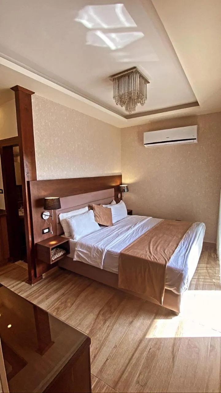 Bed in AlQimah Hotel Apartments
