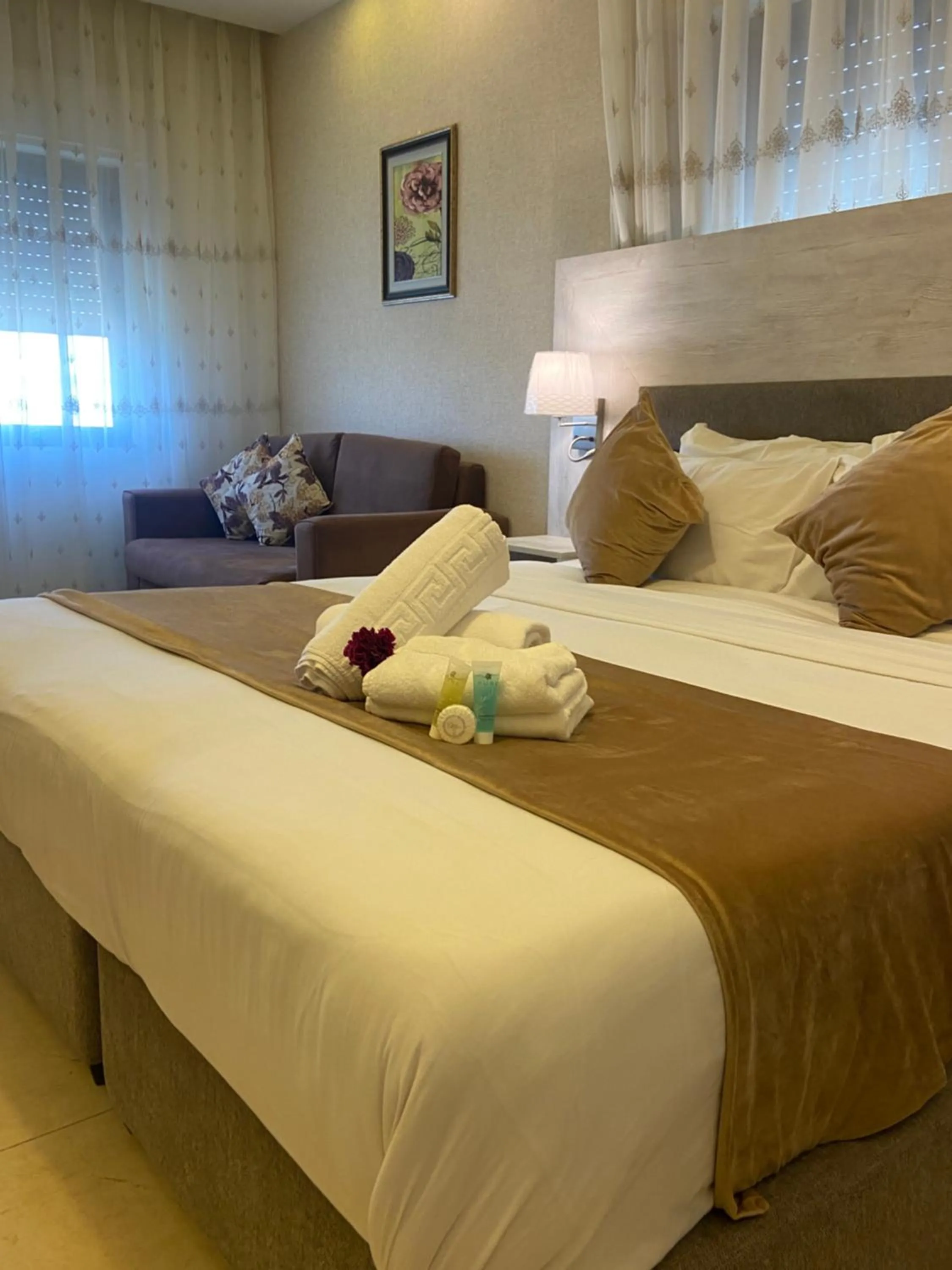 Bed in AlQimah Hotel Apartments