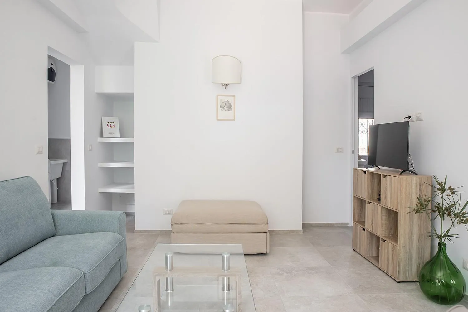 Communal lounge/ TV room in Euphorbia Apartment by Wonderful Italy