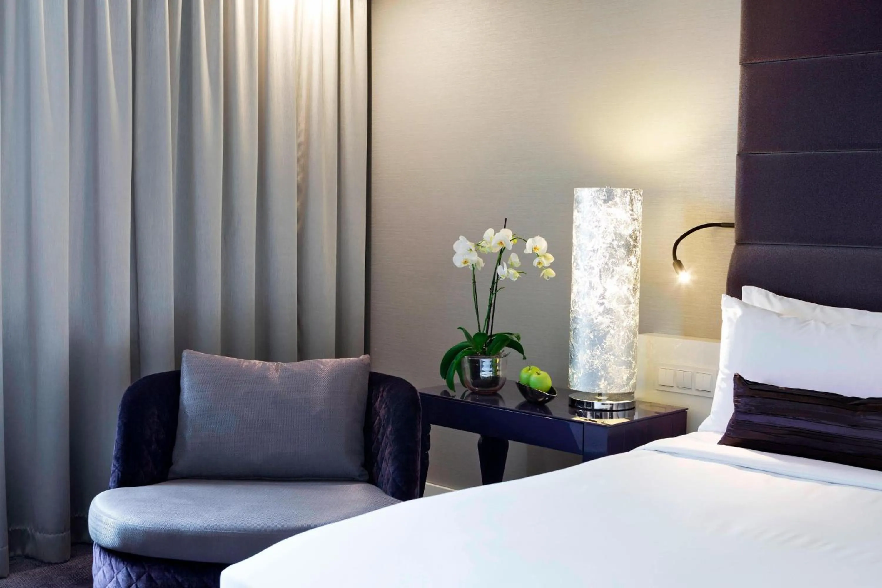 Living room, Bed in Renaissance Vienna Schönbrunn Hotel