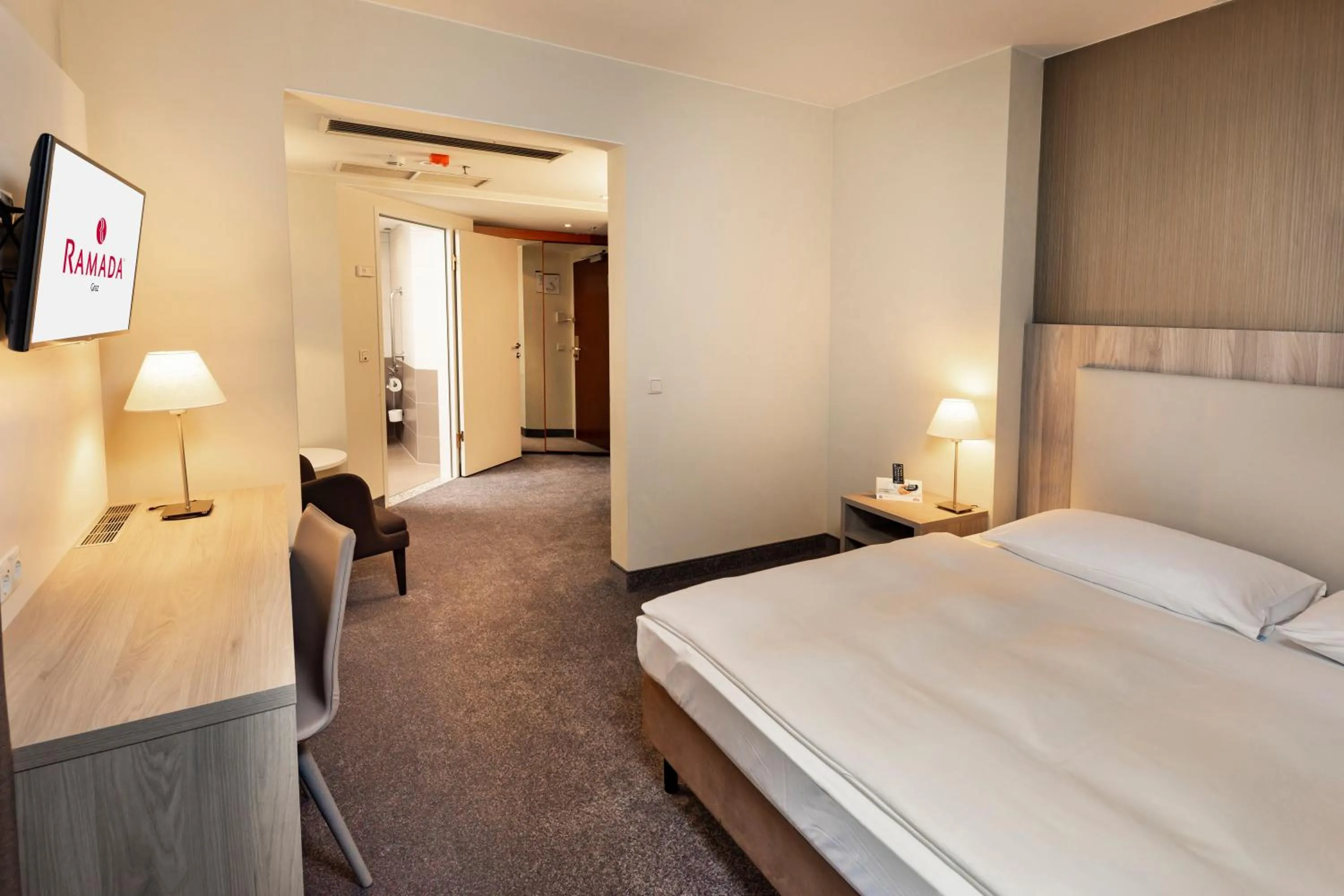 Bed in Hotel Ramada by Wyndham Graz