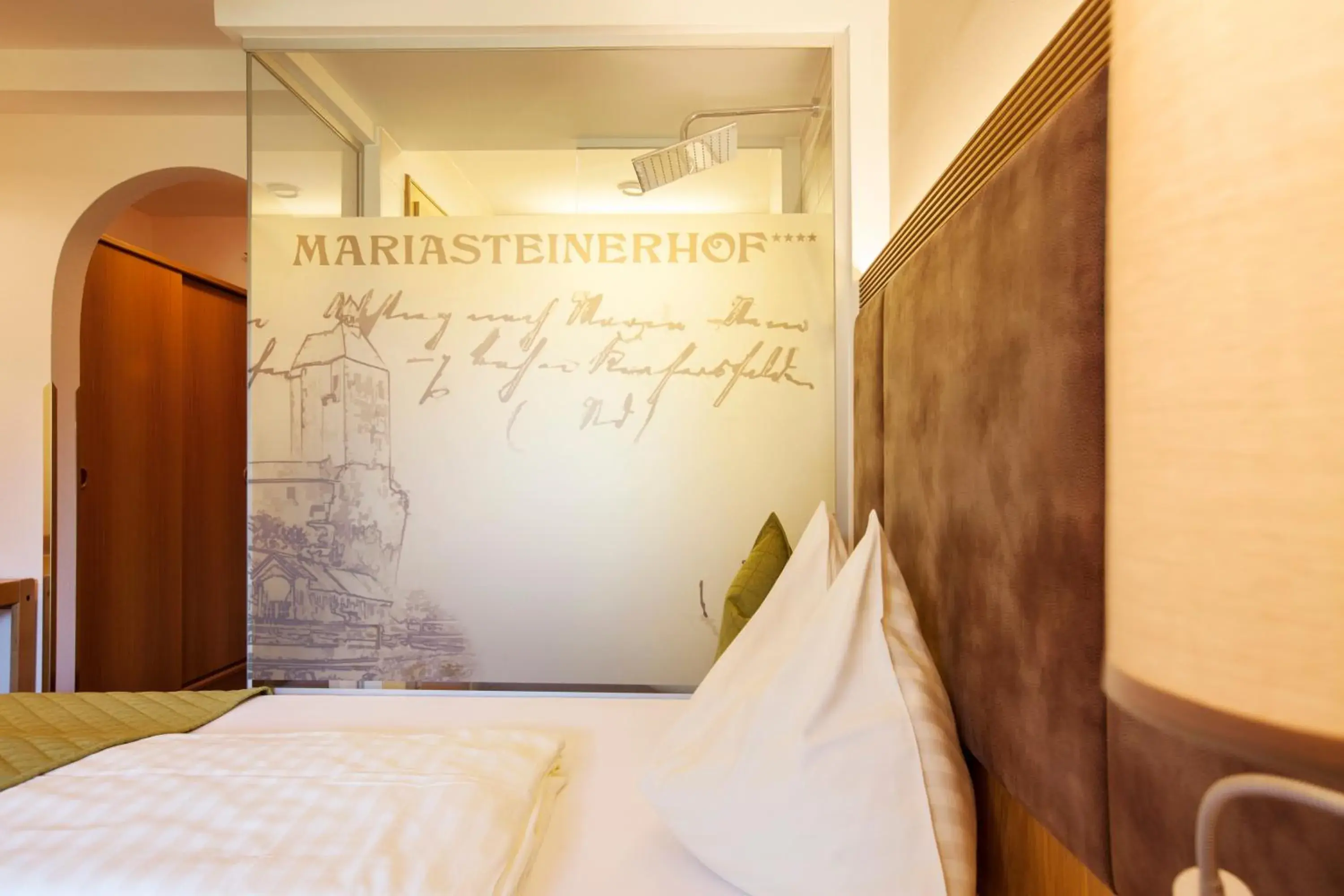 Bathroom, Bed in Hotel Mariasteinerhof Bathroom, Bed in Hotel Mariasteinerhof