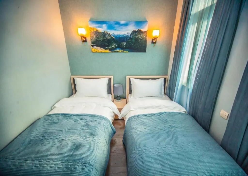 Bed in MUSMORE Boutique Hotel