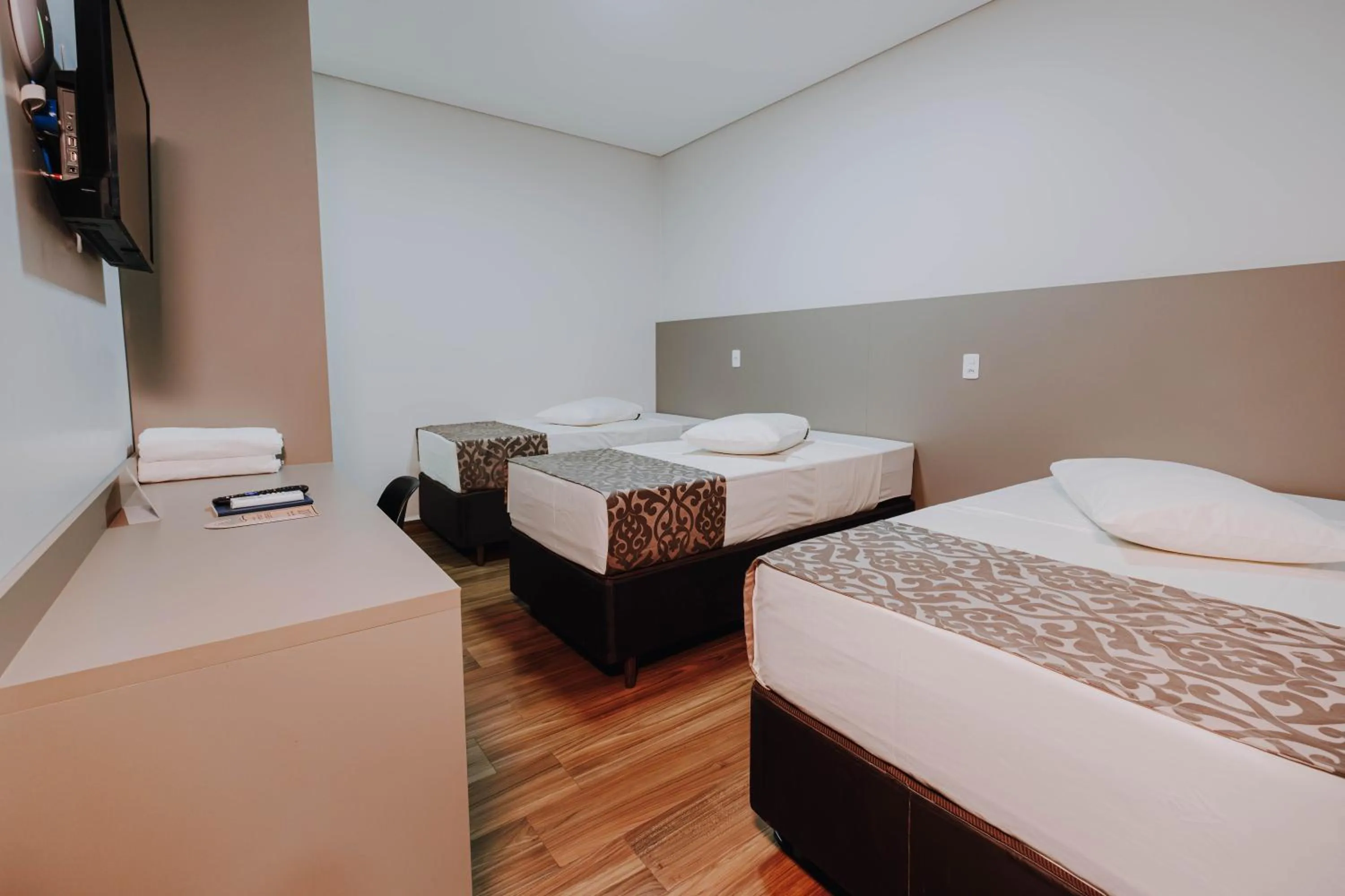 Bed in Arca's Executive Hotel