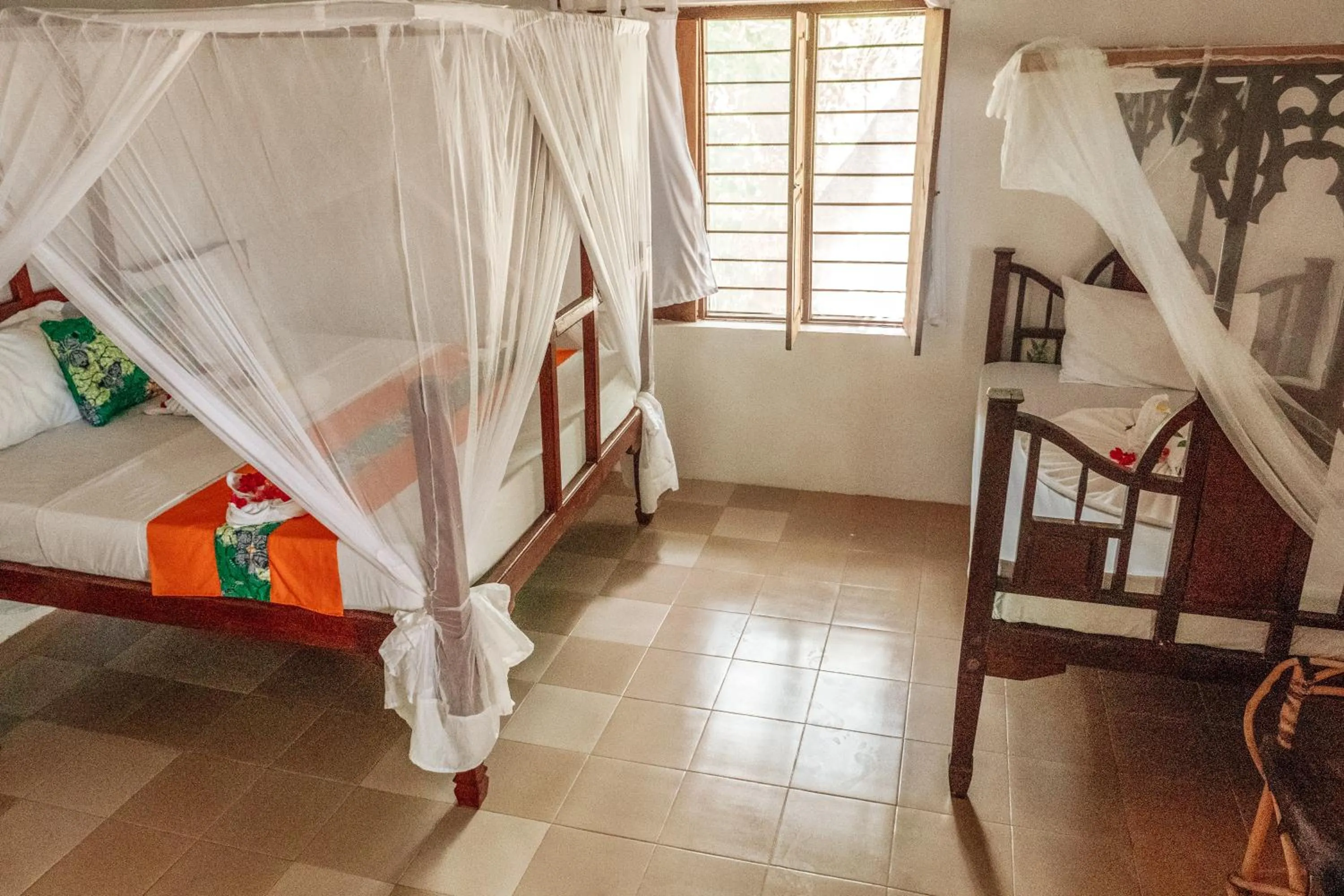 Photo of the whole room, Bed in Zanzibar Gem Beach Bungalows