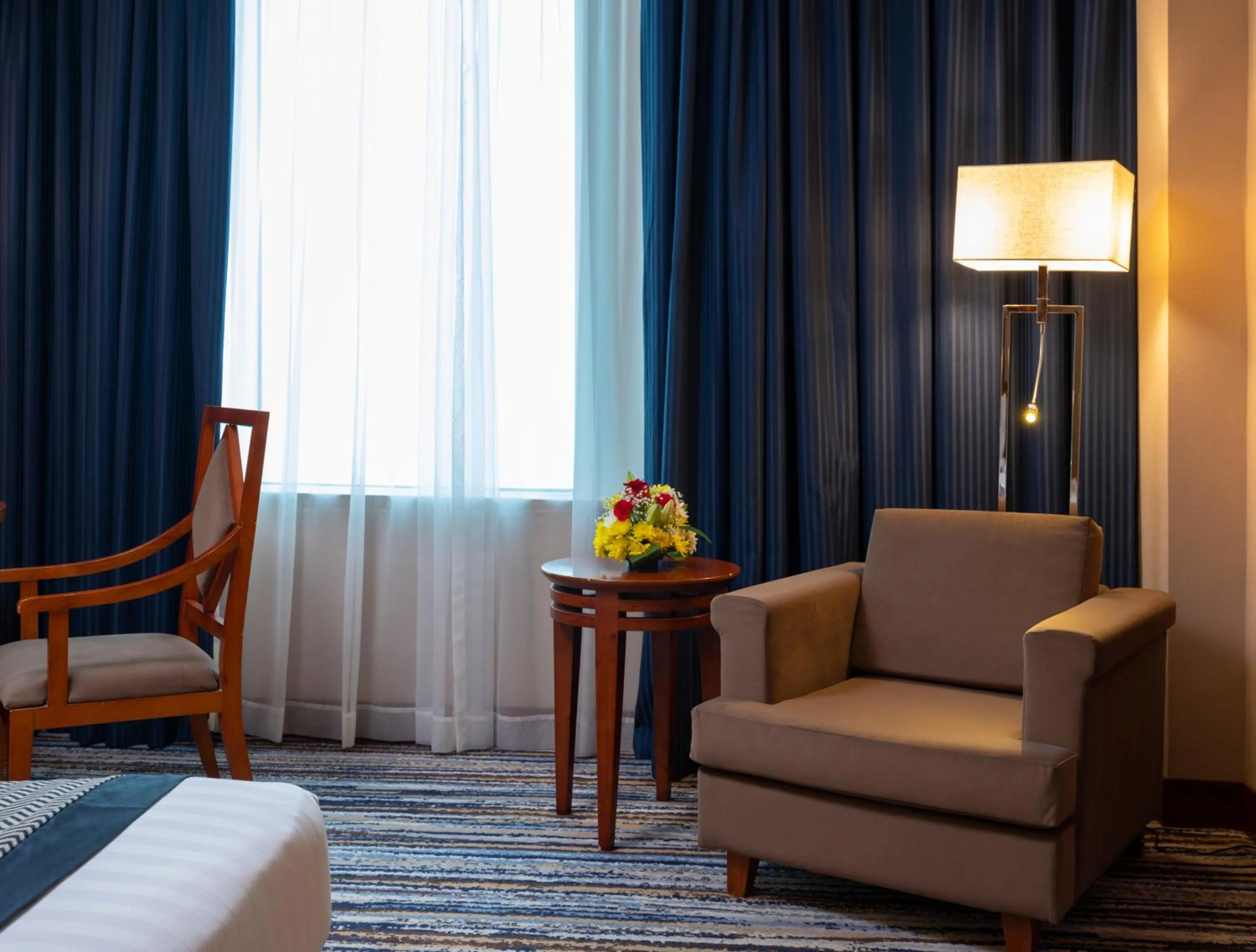 Living room, Bed in Retaj Al Rayyan