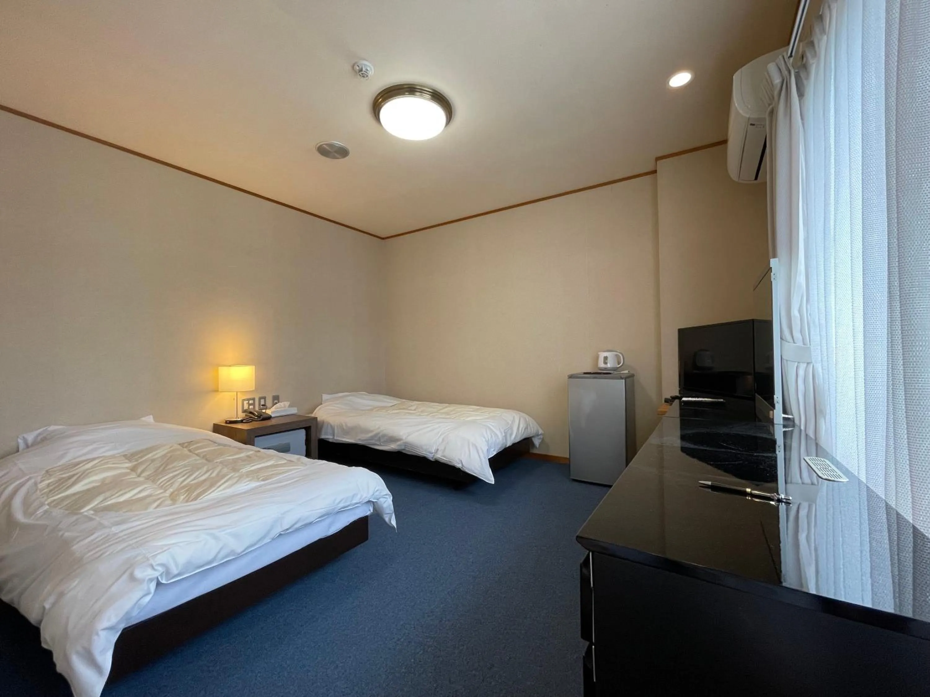 Photo of the whole room, Bed in Marina Hotel Kaikuu