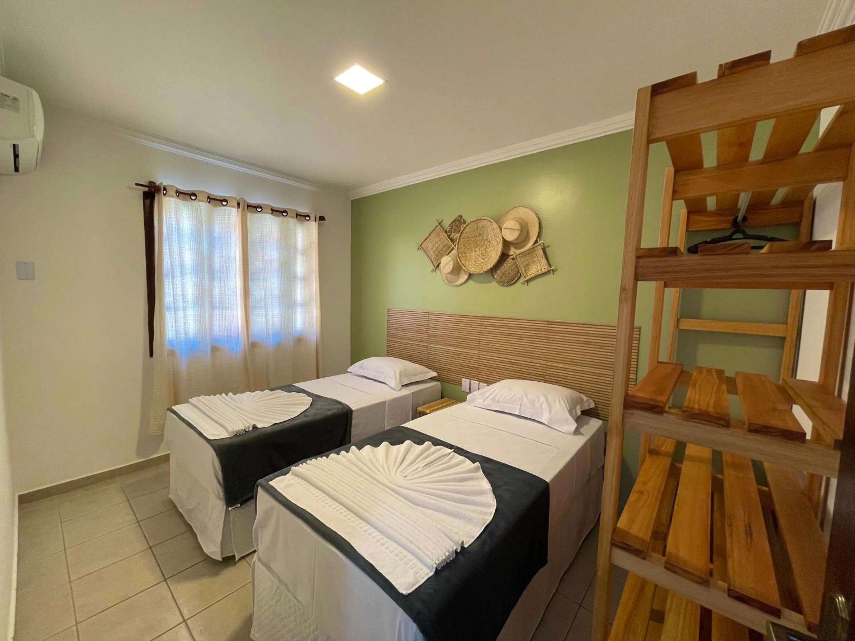 Bed in MUTA PRAIA HOTEL