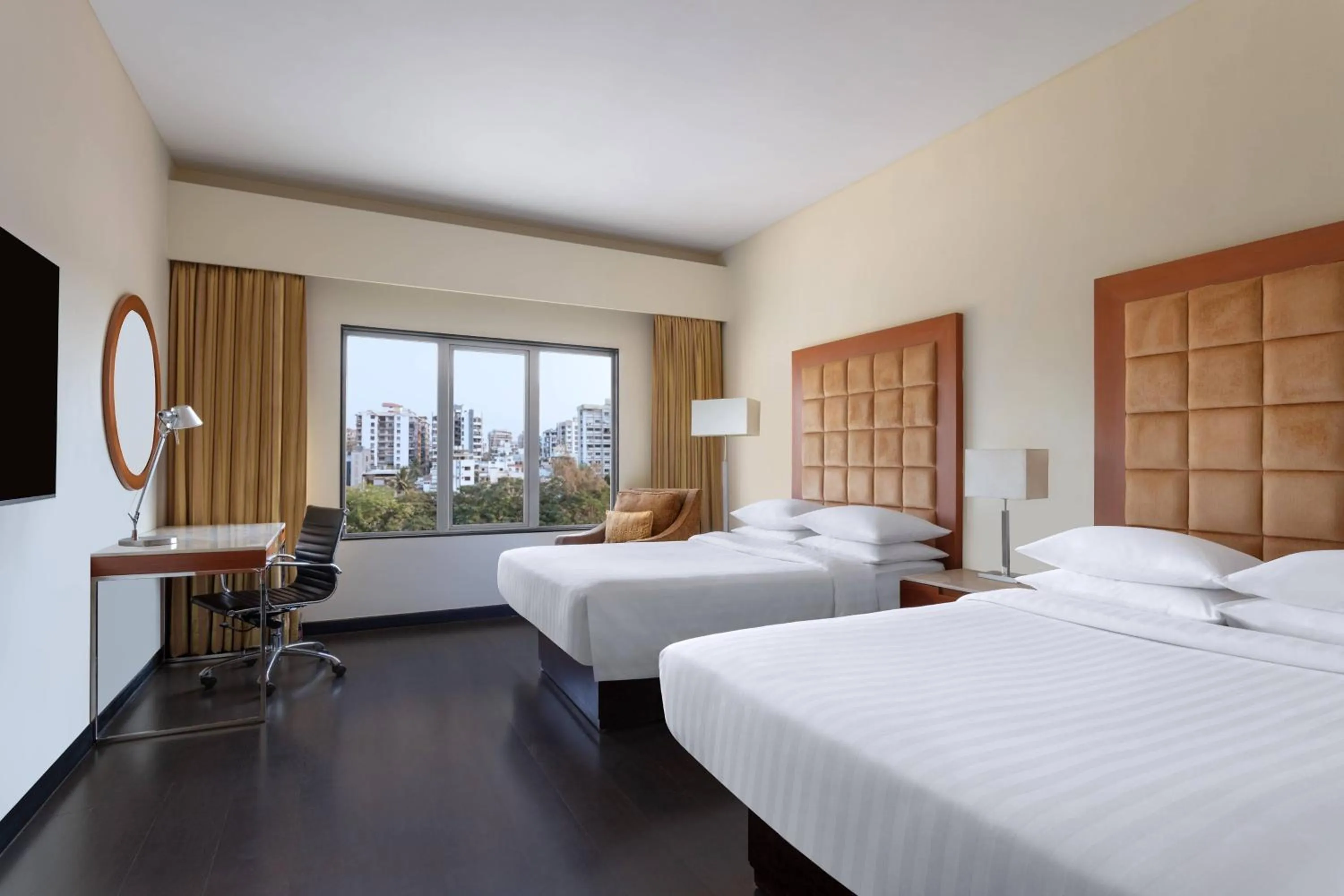 Photo of the whole room, Bed in Surat Marriott Hotel