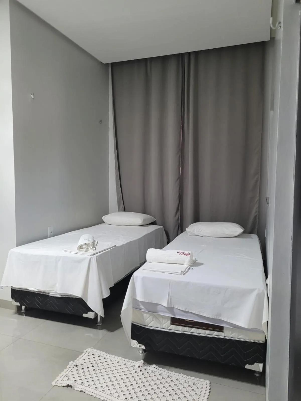 Bed in POUSADA ALÉM-K