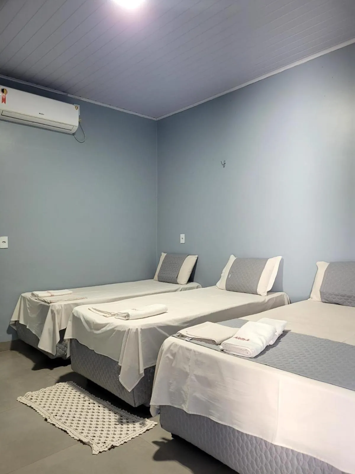 Bed in POUSADA ALÉM-K