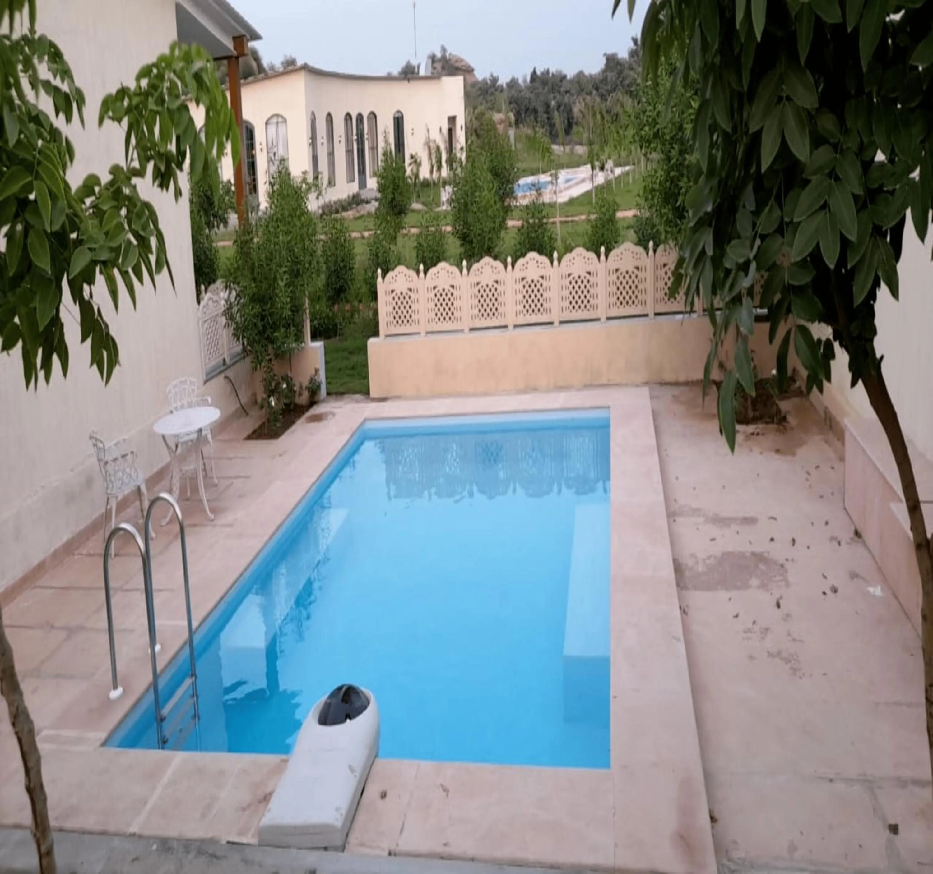 Swimming pool in WelcomHeritage Cheetahgarh Resort & Spa
