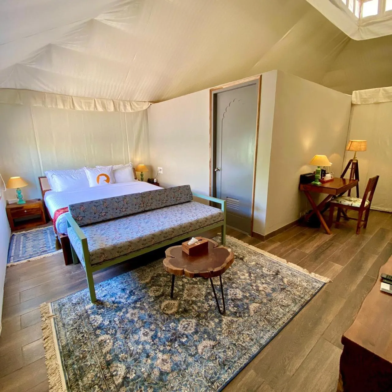 Bed in WelcomHeritage Cheetahgarh Resort & Spa
