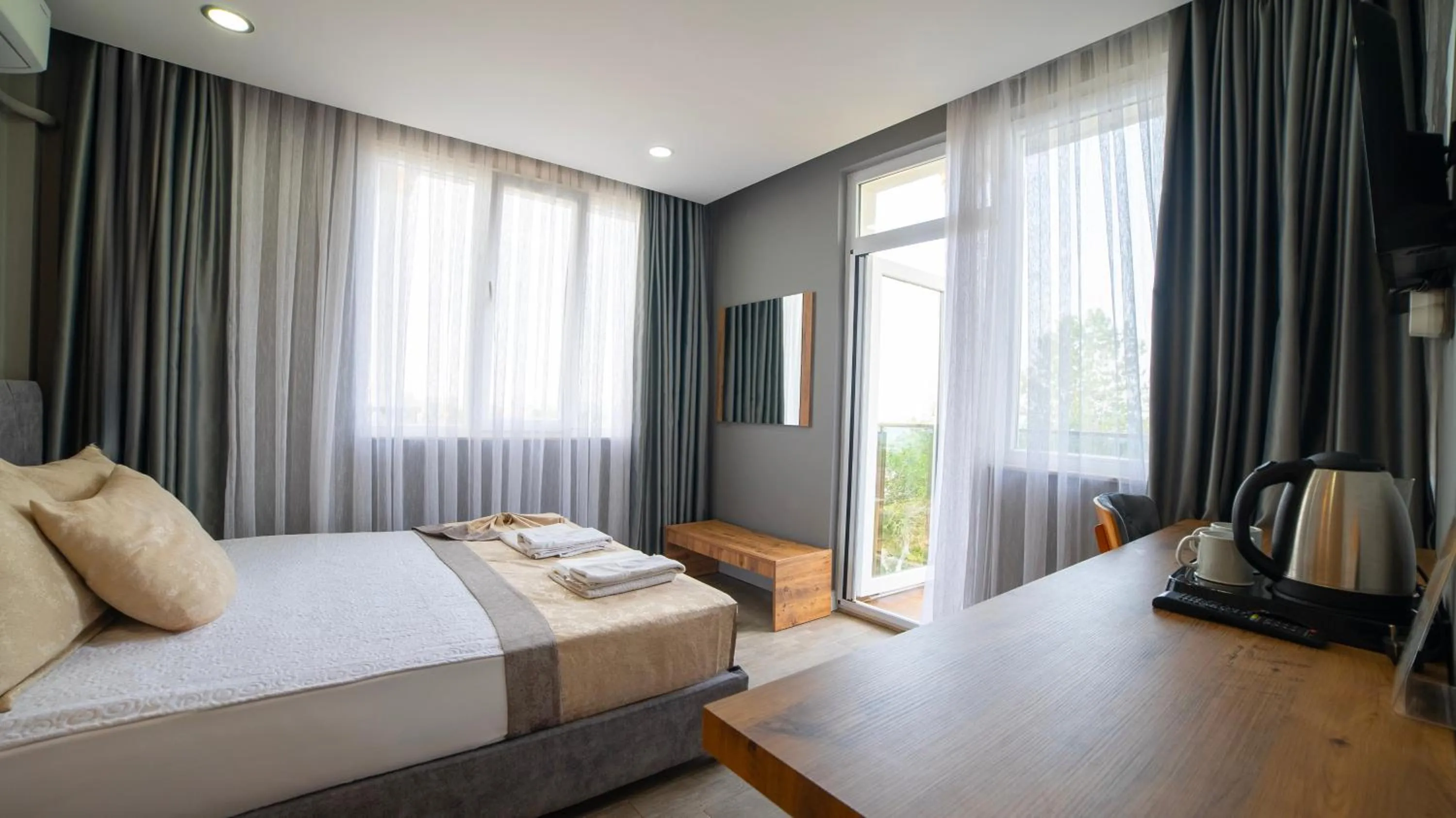 Bed in La Cactus Boutique Hotel