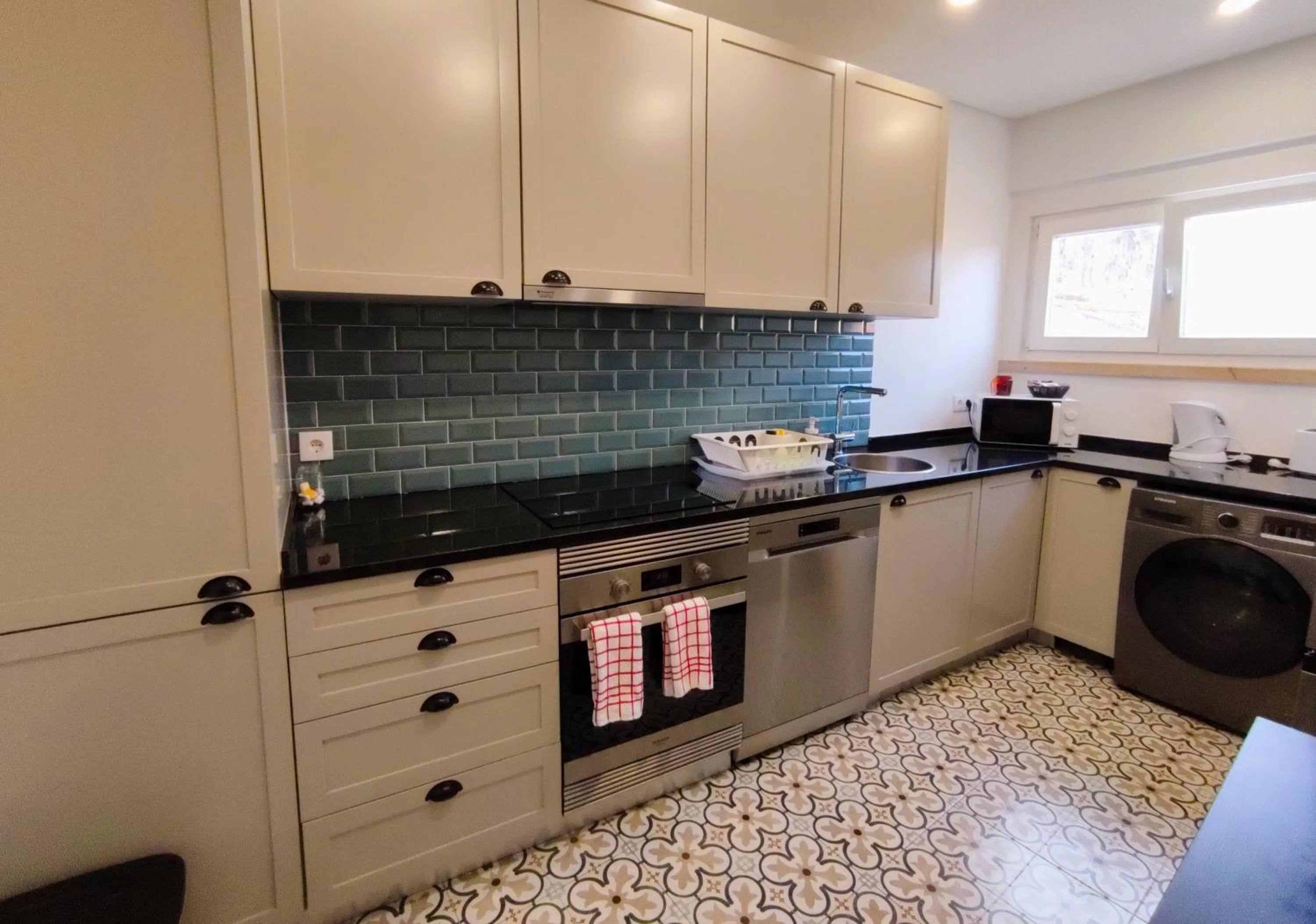 Kitchen or kitchenette in Casas da Biquinha