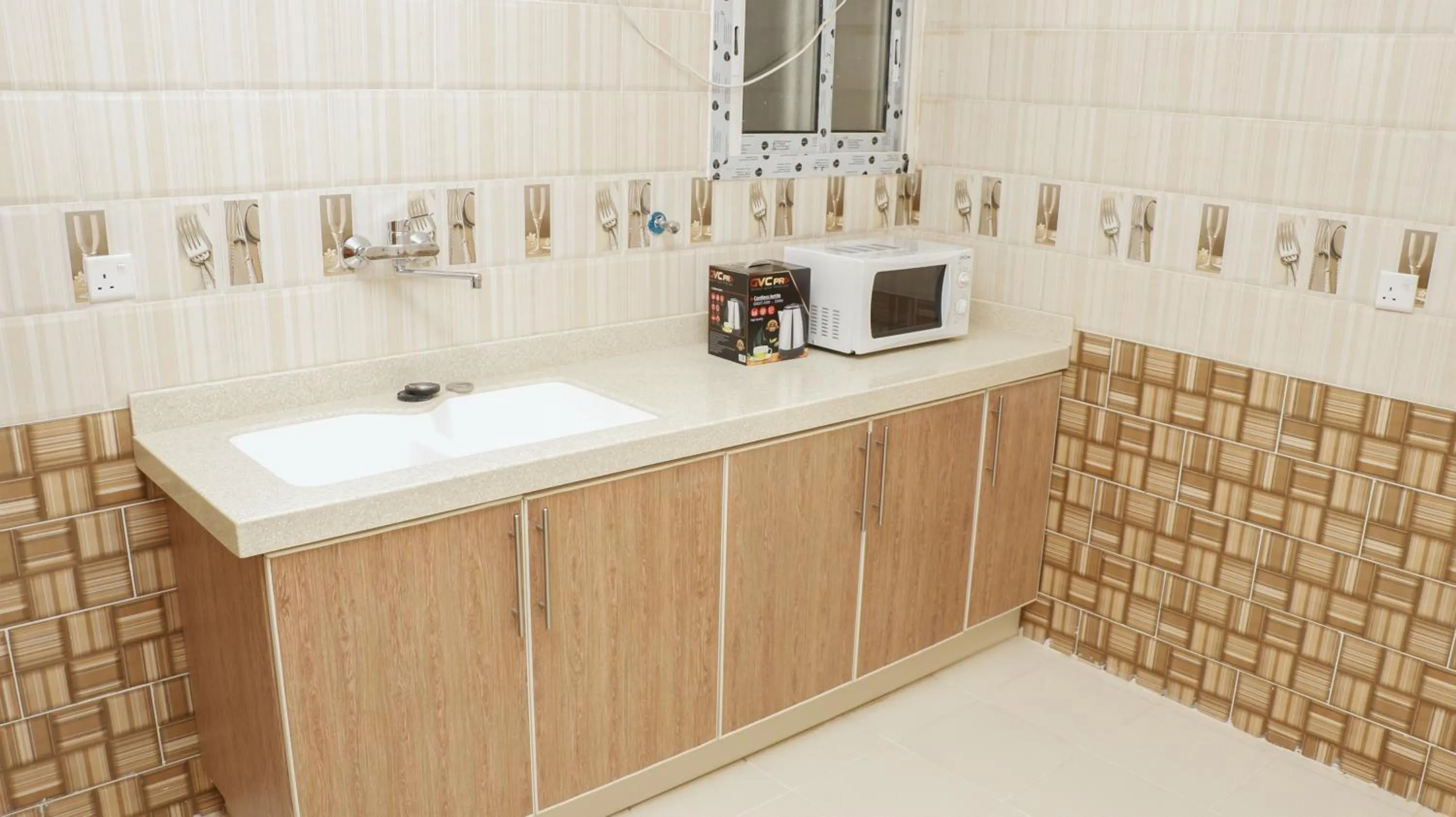 Communal kitchen in Diafat Alsaadah For Serviced Apartment-Dumat Al Jandal
