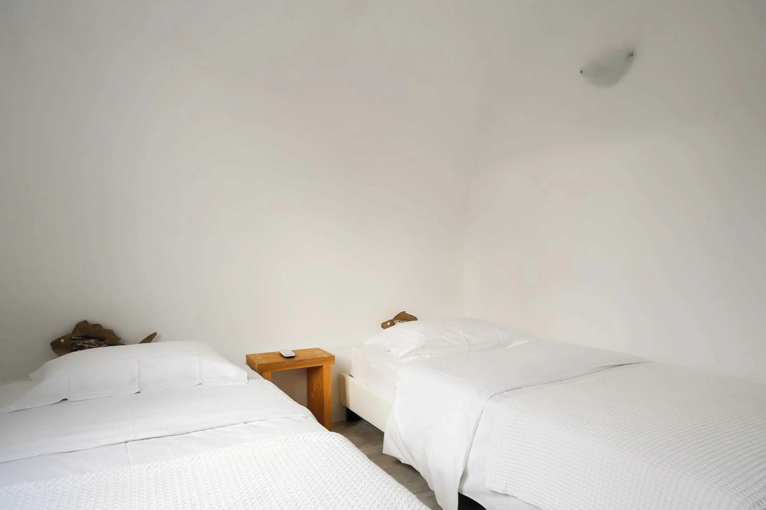 Bed in Exi Sea Side Suites