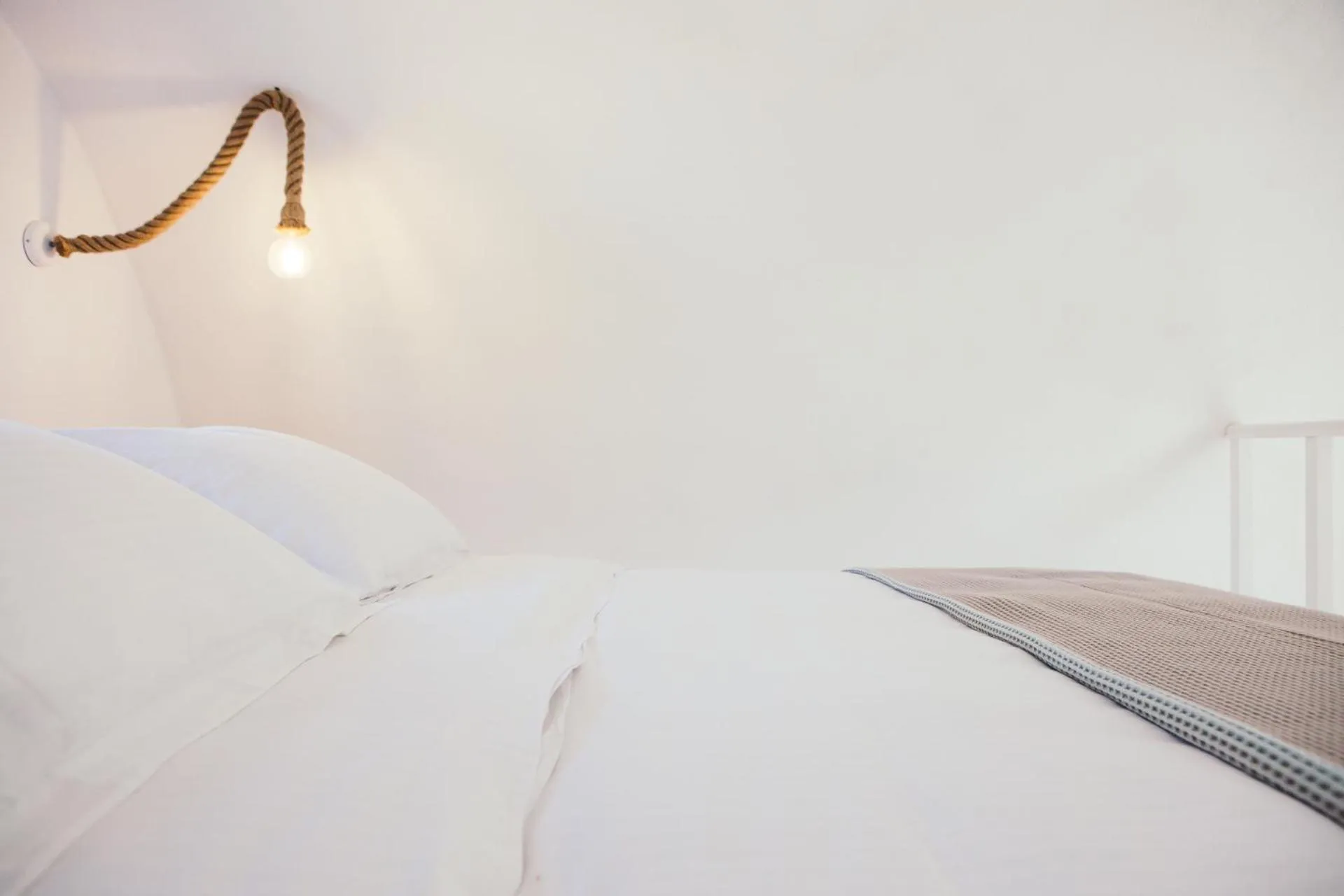 Bed in Exi Sea Side Suites