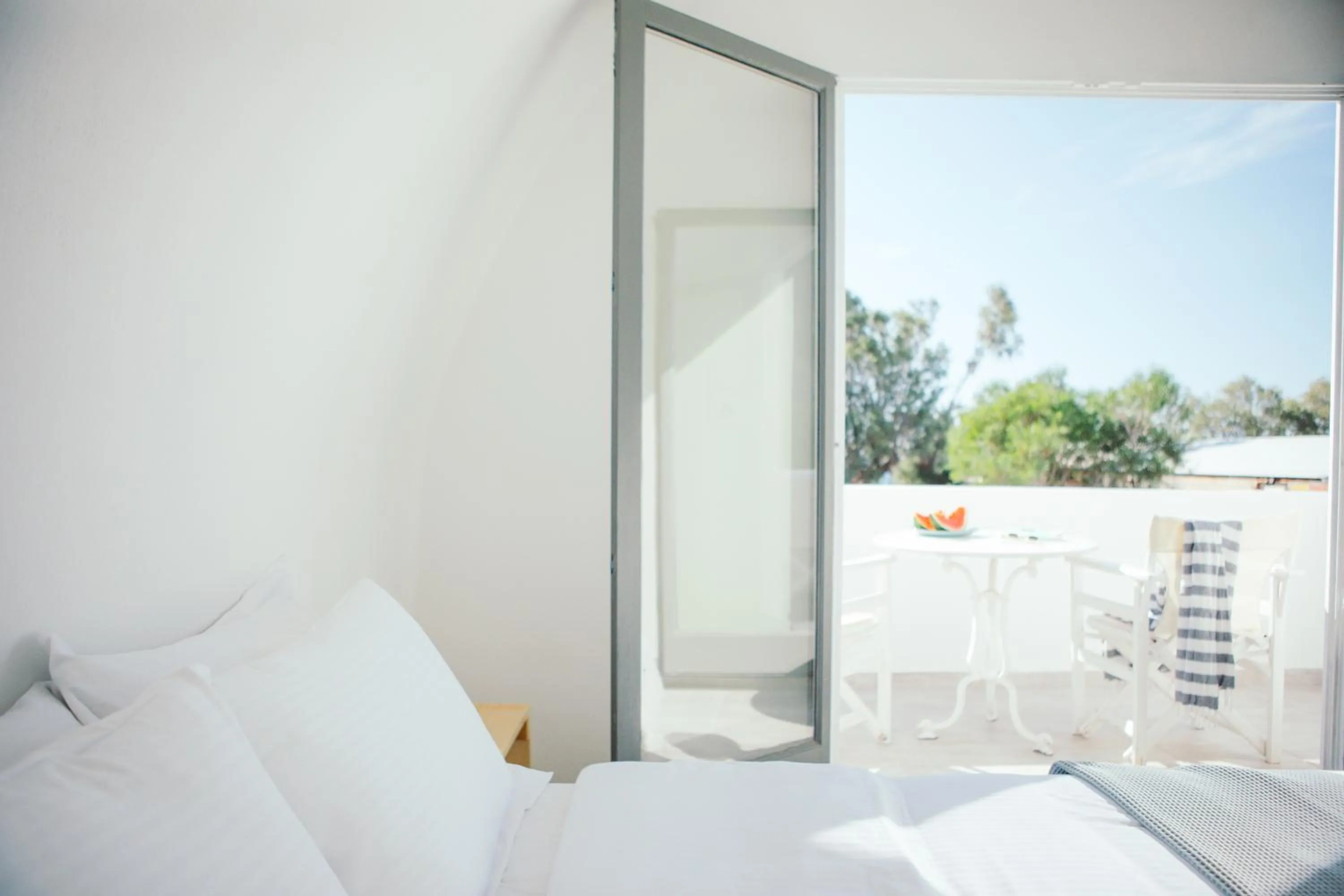 Patio, Bed in Exi Sea Side Suites