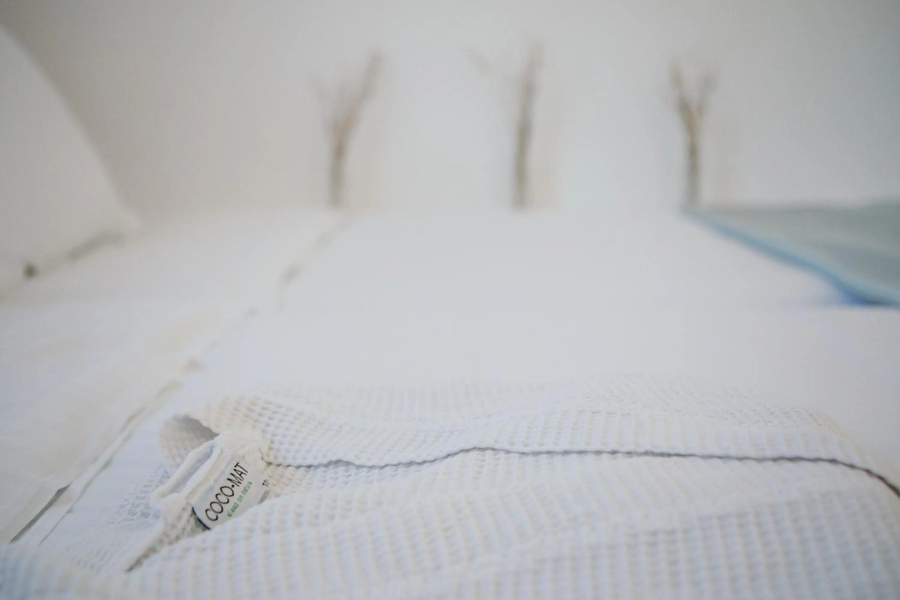 Bed in Exi Sea Side Suites