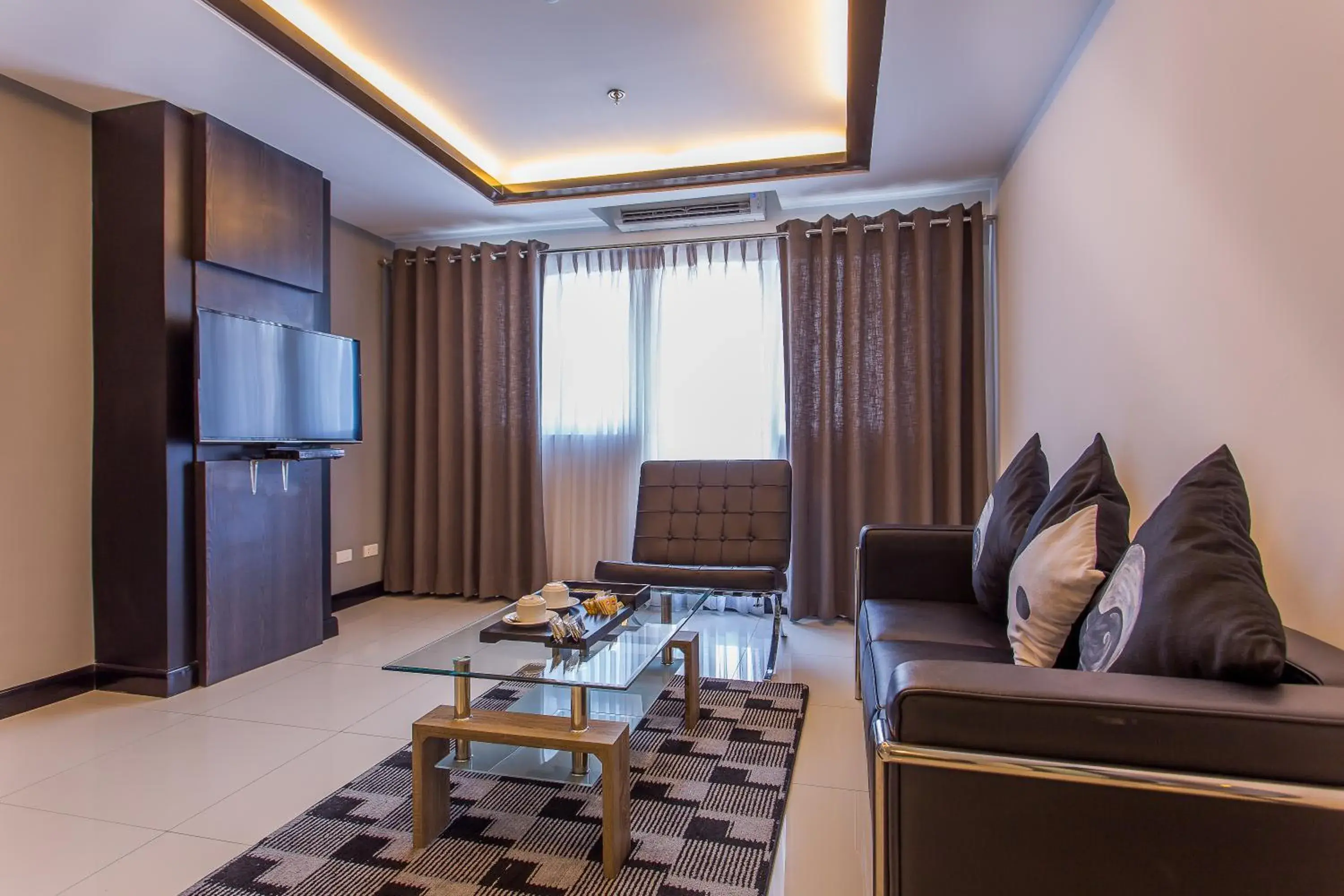 Living room in Y2 Residence Hotel Managed by HII Living room in Y2 Residence Hotel Managed by HII