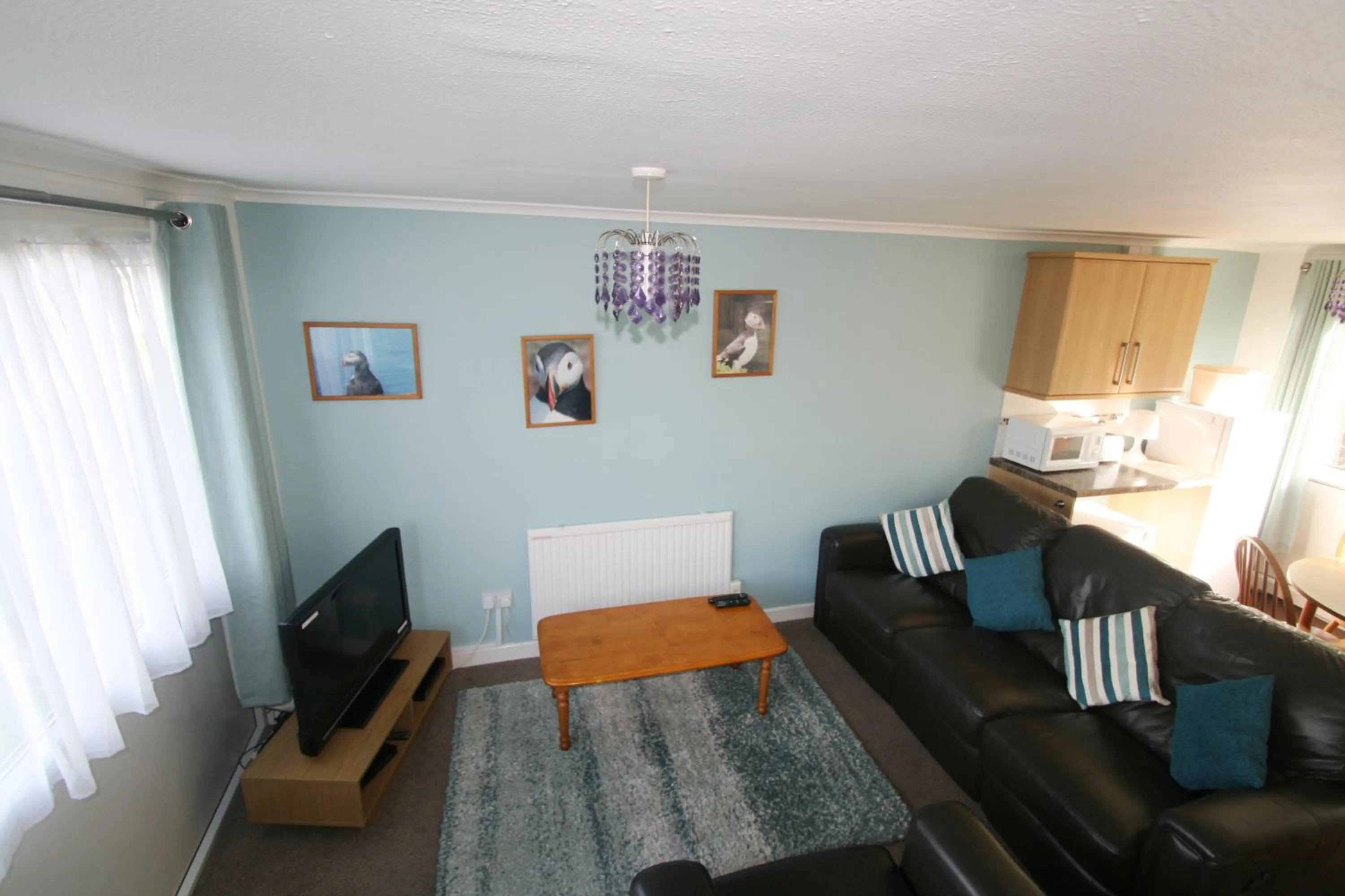 Living room in Freshwater Bay Holiday Cottages