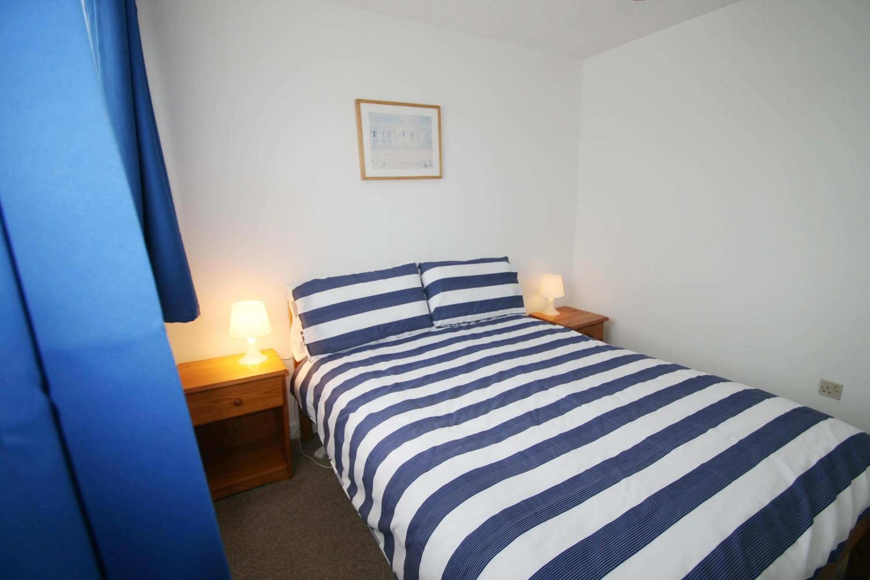 Bedroom, Bed in Freshwater Bay Holiday Cottages