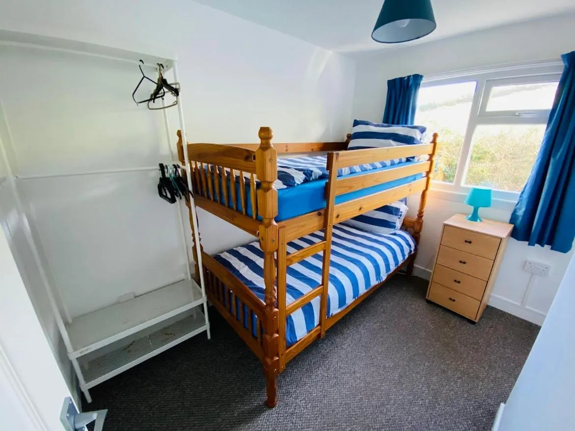Bed in Freshwater Bay Holiday Cottages