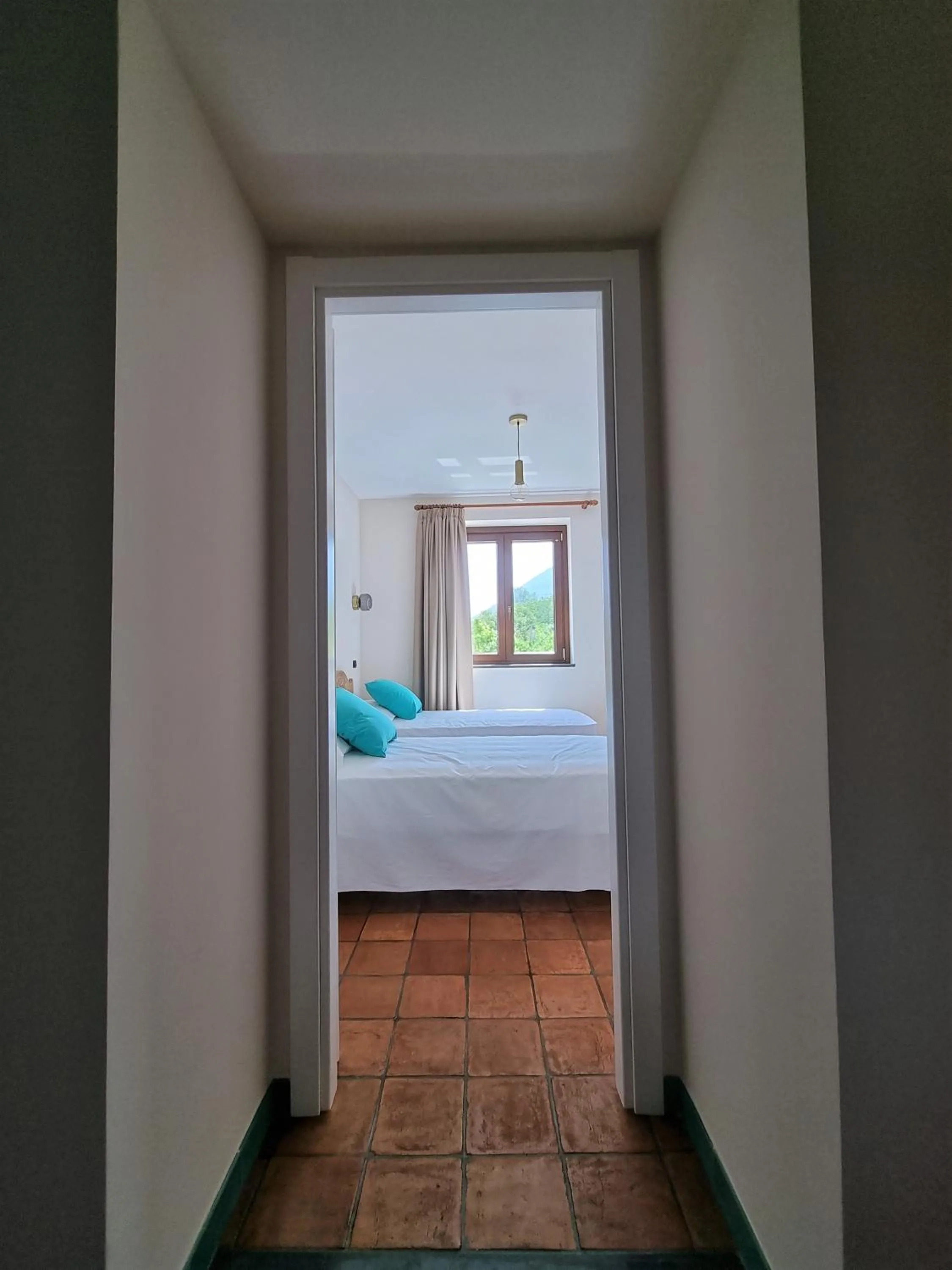 Bed in Casa Fifina Rooms