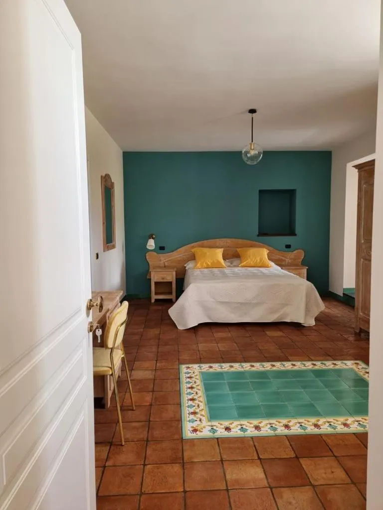 Bed in Casa Fifina Rooms