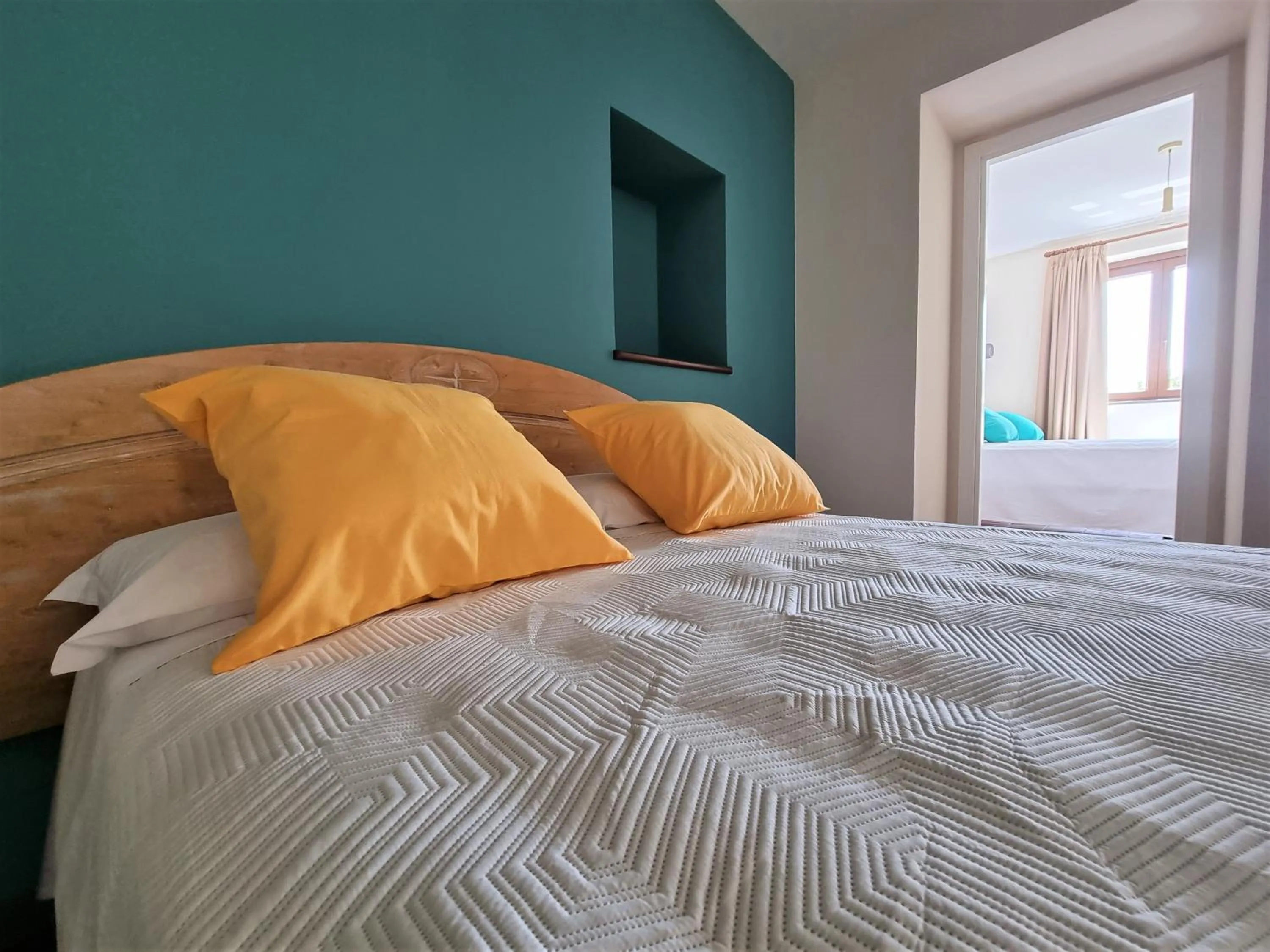 Bed in Casa Fifina Rooms